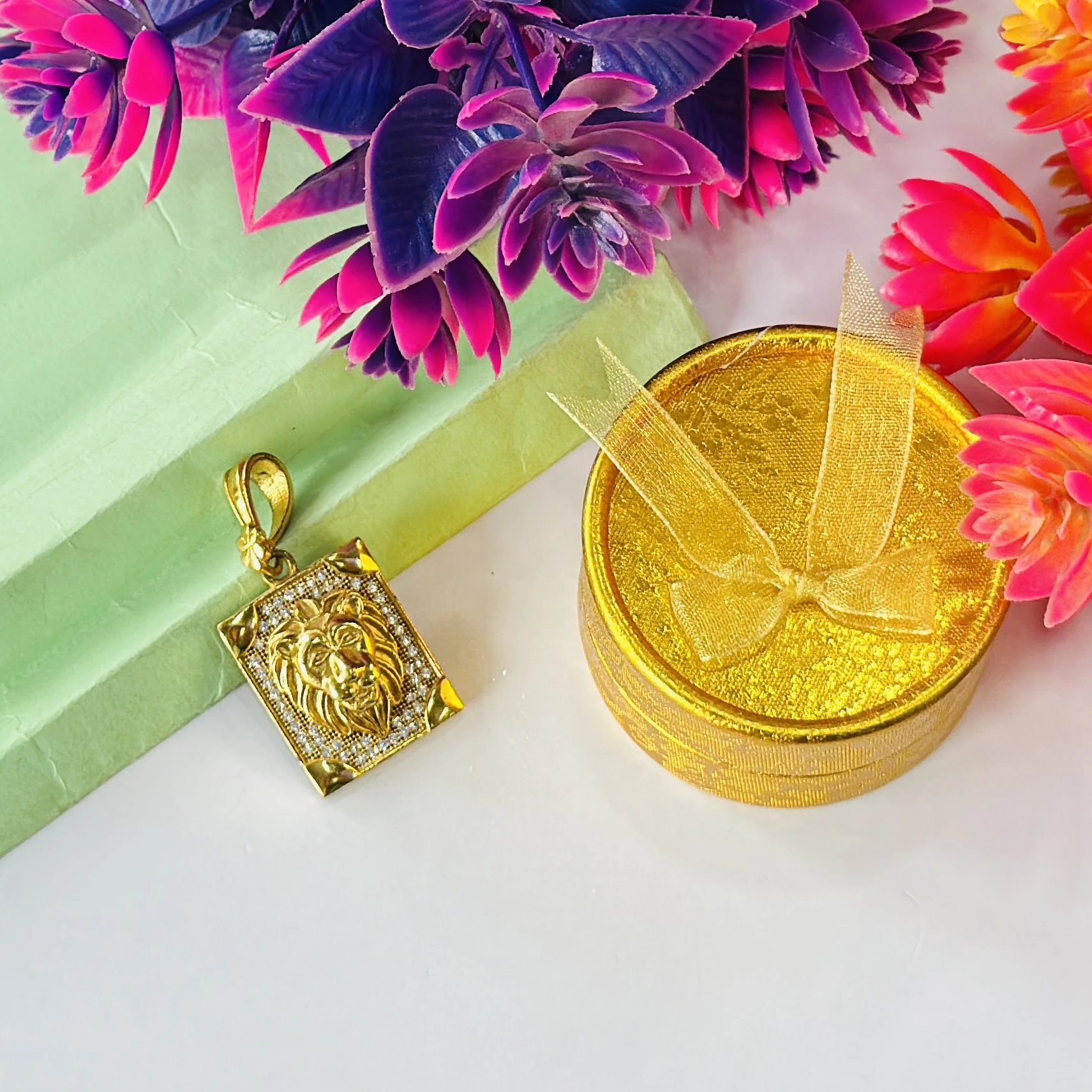 Gold plated lion face pendant
