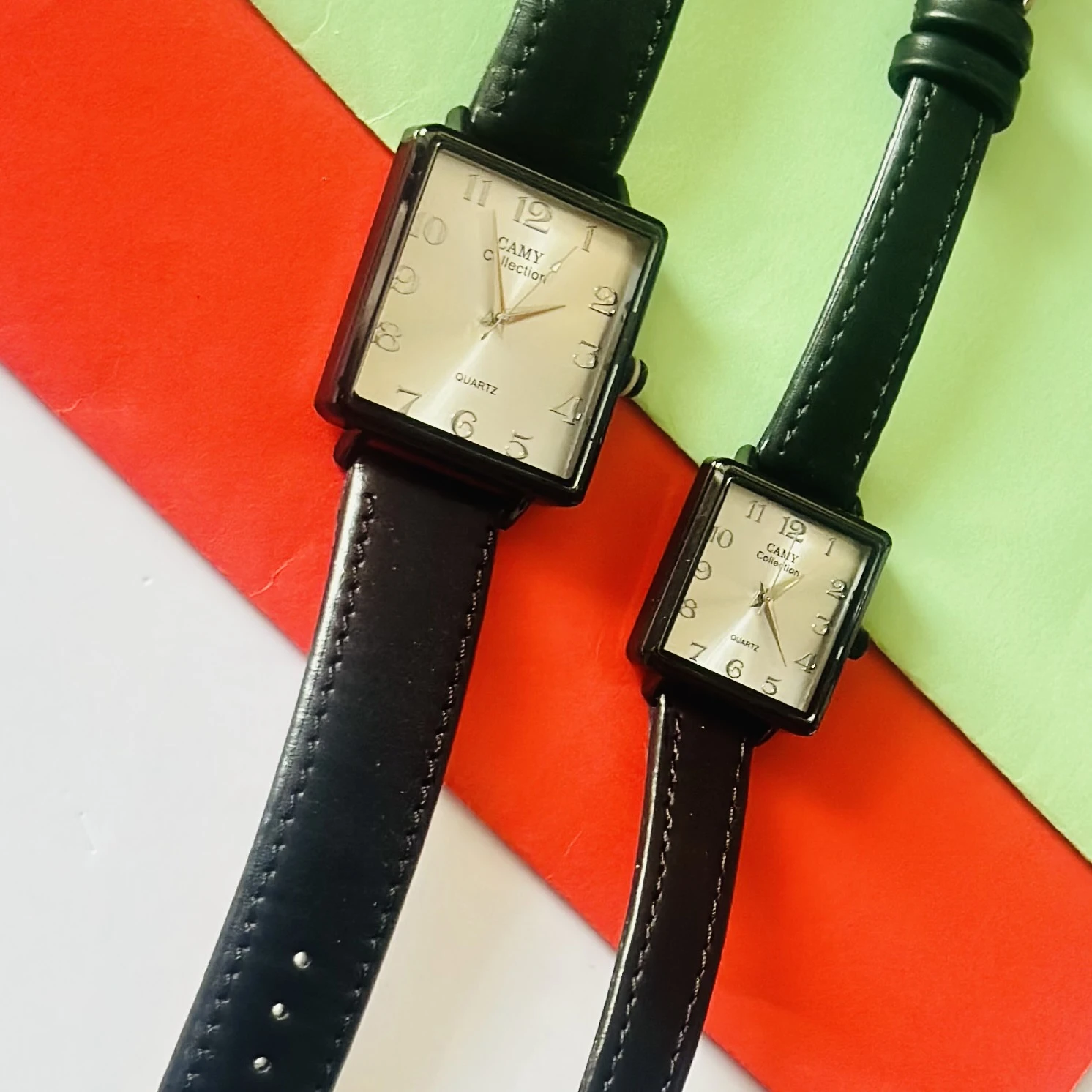 Camy Collection analog quartz watches with black leather straps and square dials.