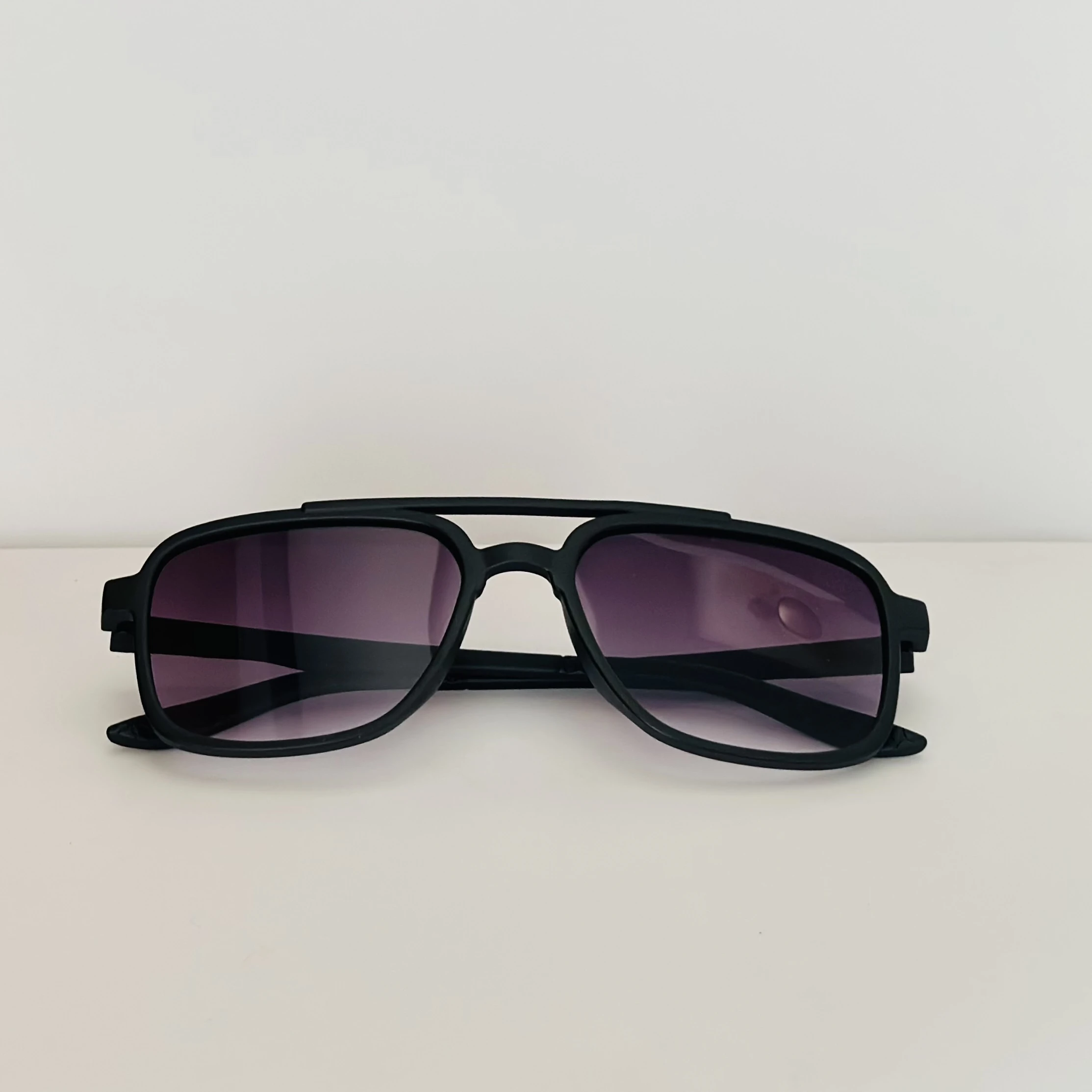 Black retro square sunglasses with gradient purple lenses.