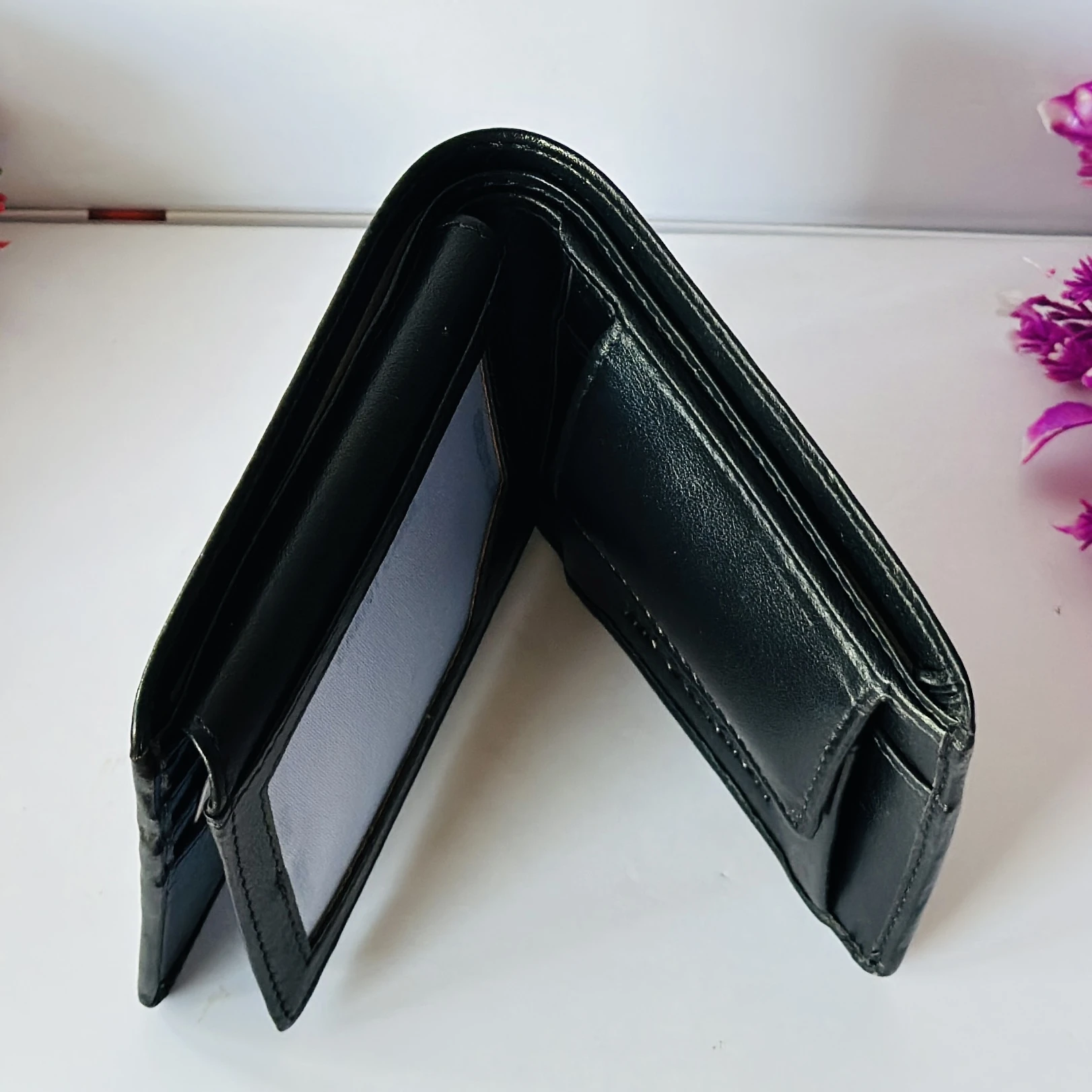 United Colors of Benetton black leather bi-fold wallet.