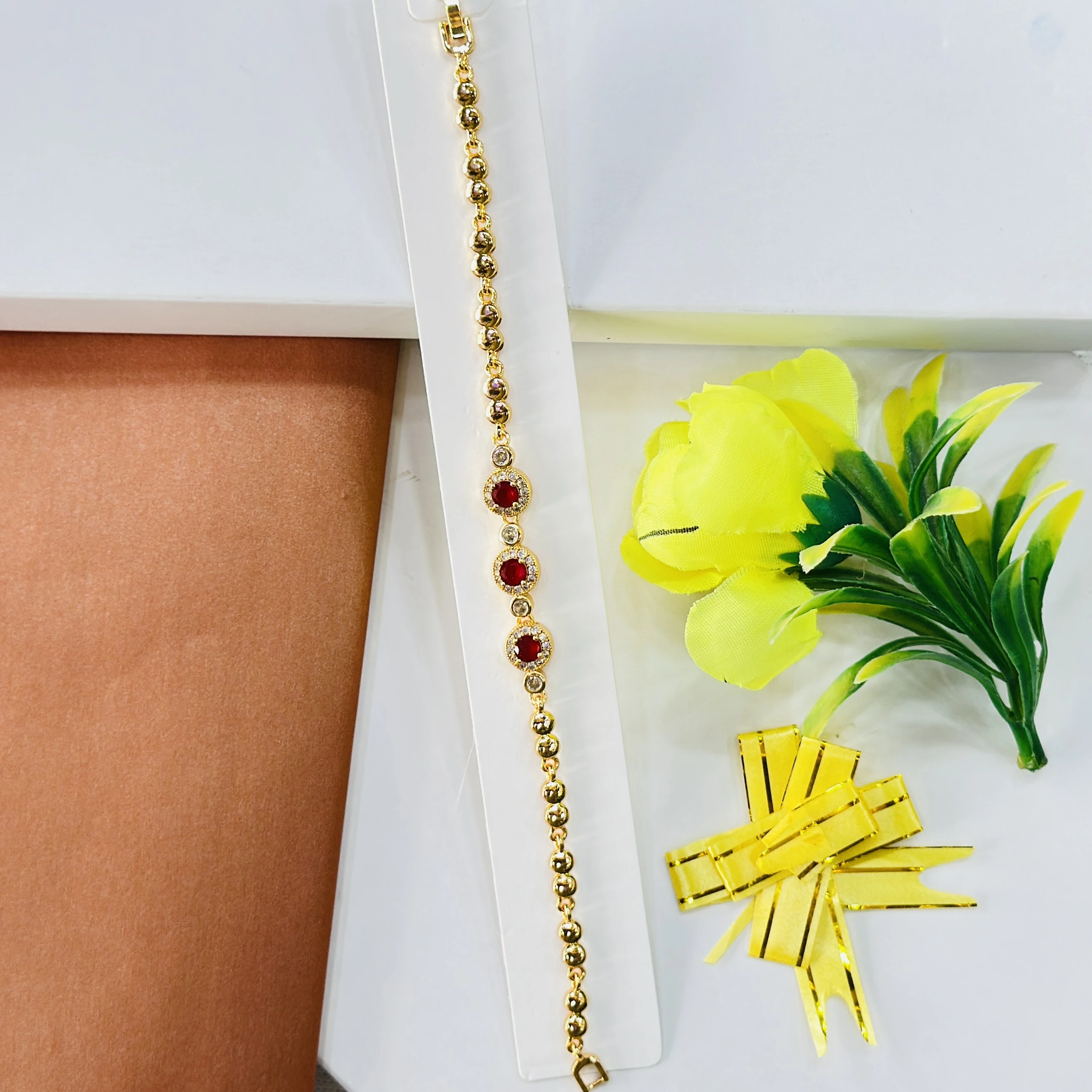gold-plated bracelet decorated with red stones