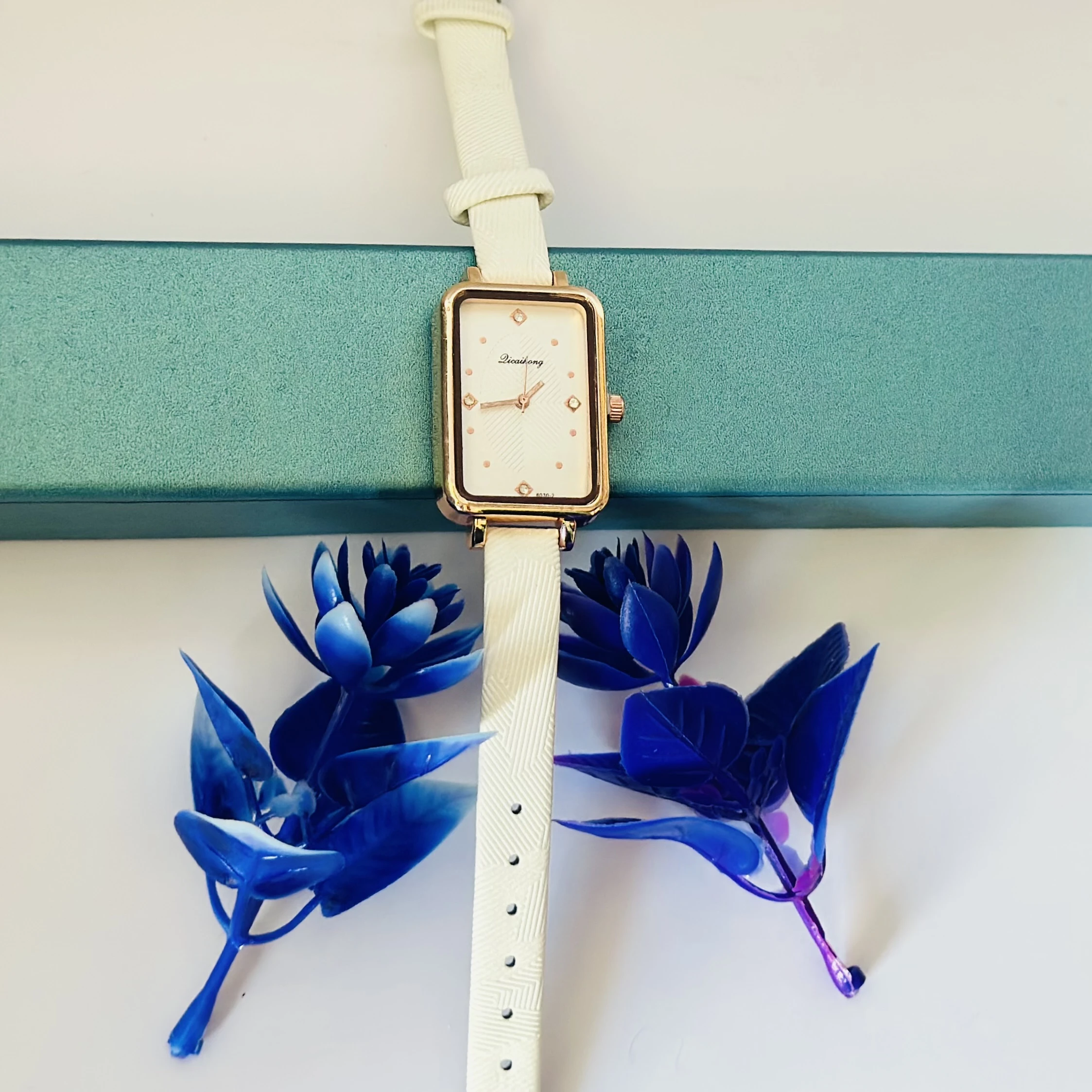 White Focus quartz analog watch for women with a white leather strap.