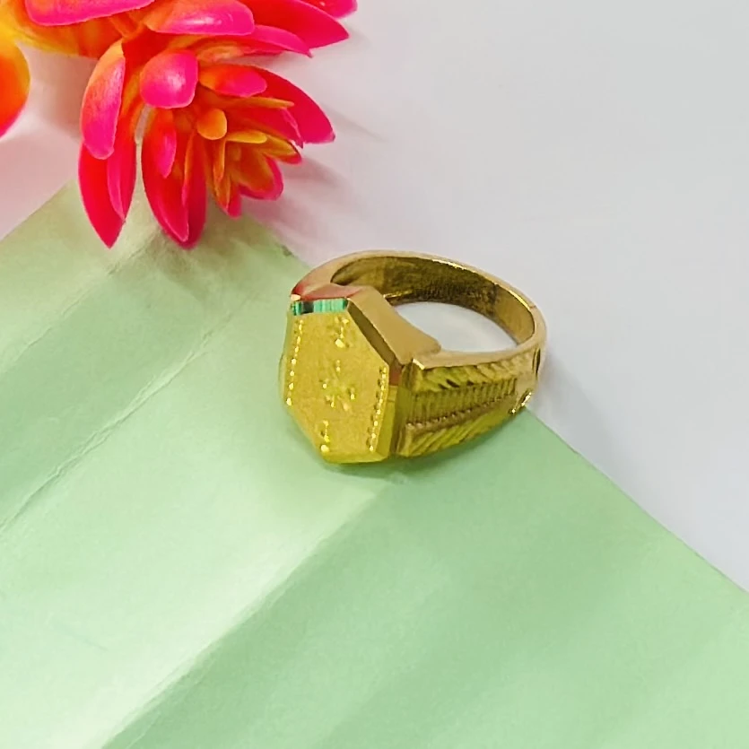 22kt yellow gold men's ring with a matte finish and machine-cut designs.