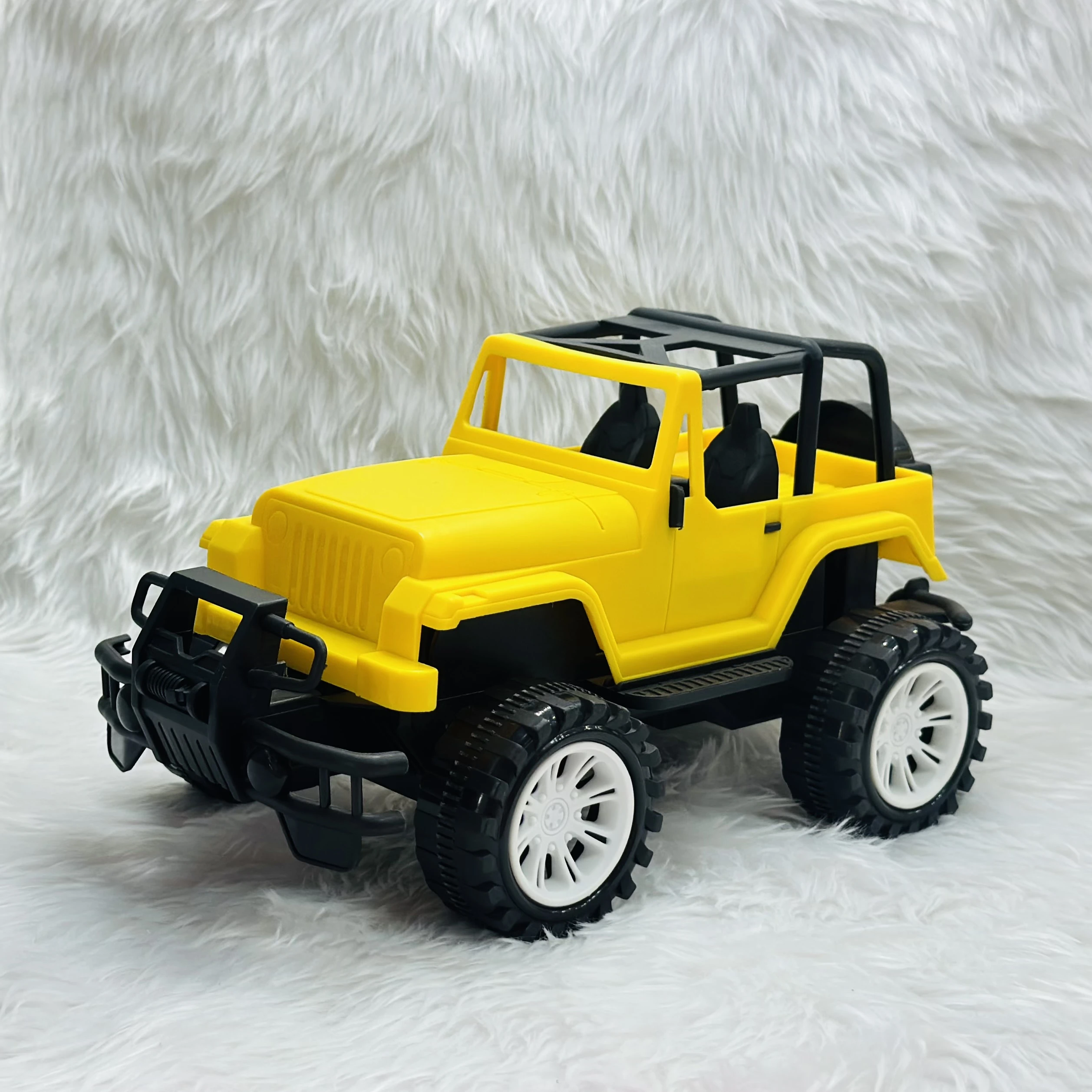 Yellow plastic toy jeep