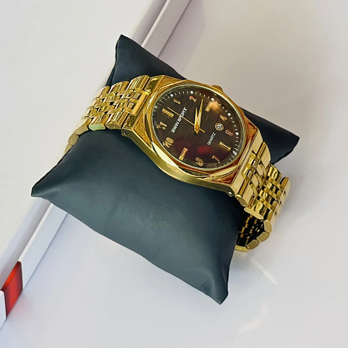 Gold tone AWIN SPORT quartz analog watch for men with a metal strap.