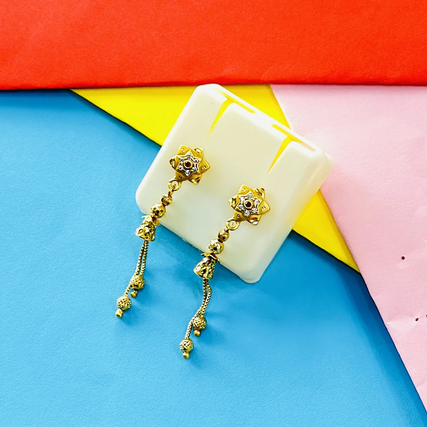 pair of intricate gold drop earrings