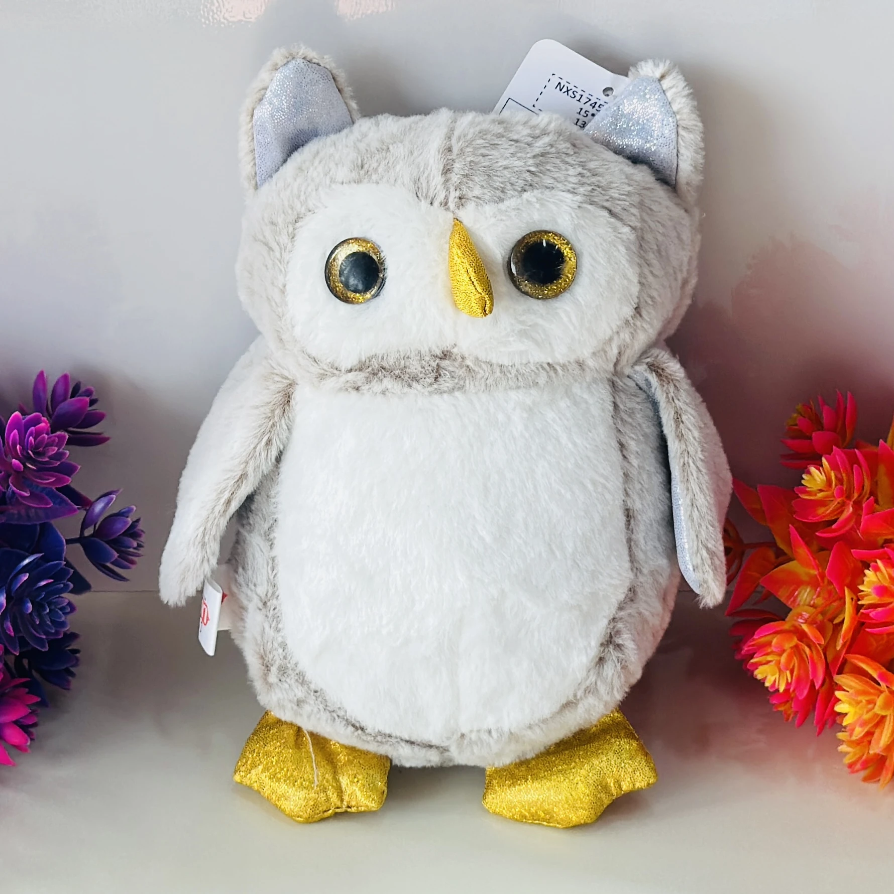 Grey and white plush owl soft toy with glitter accents.