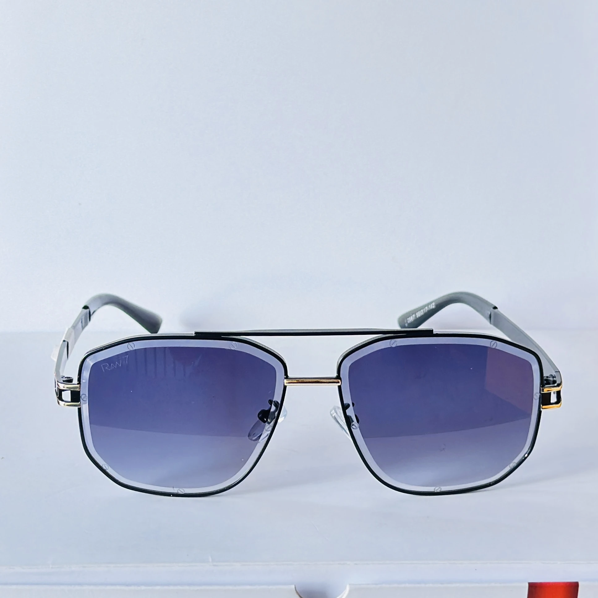Black sunglasses feature a distinct metal frame