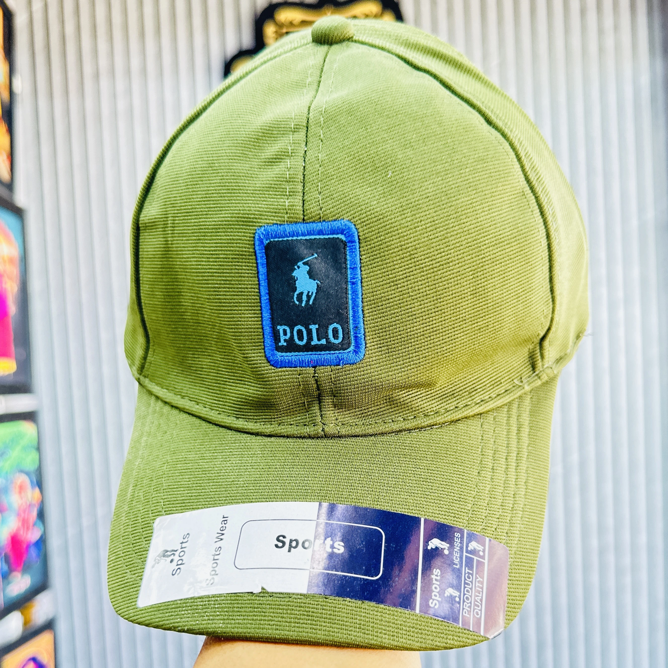 appears to be a green cotton blend baseball cap