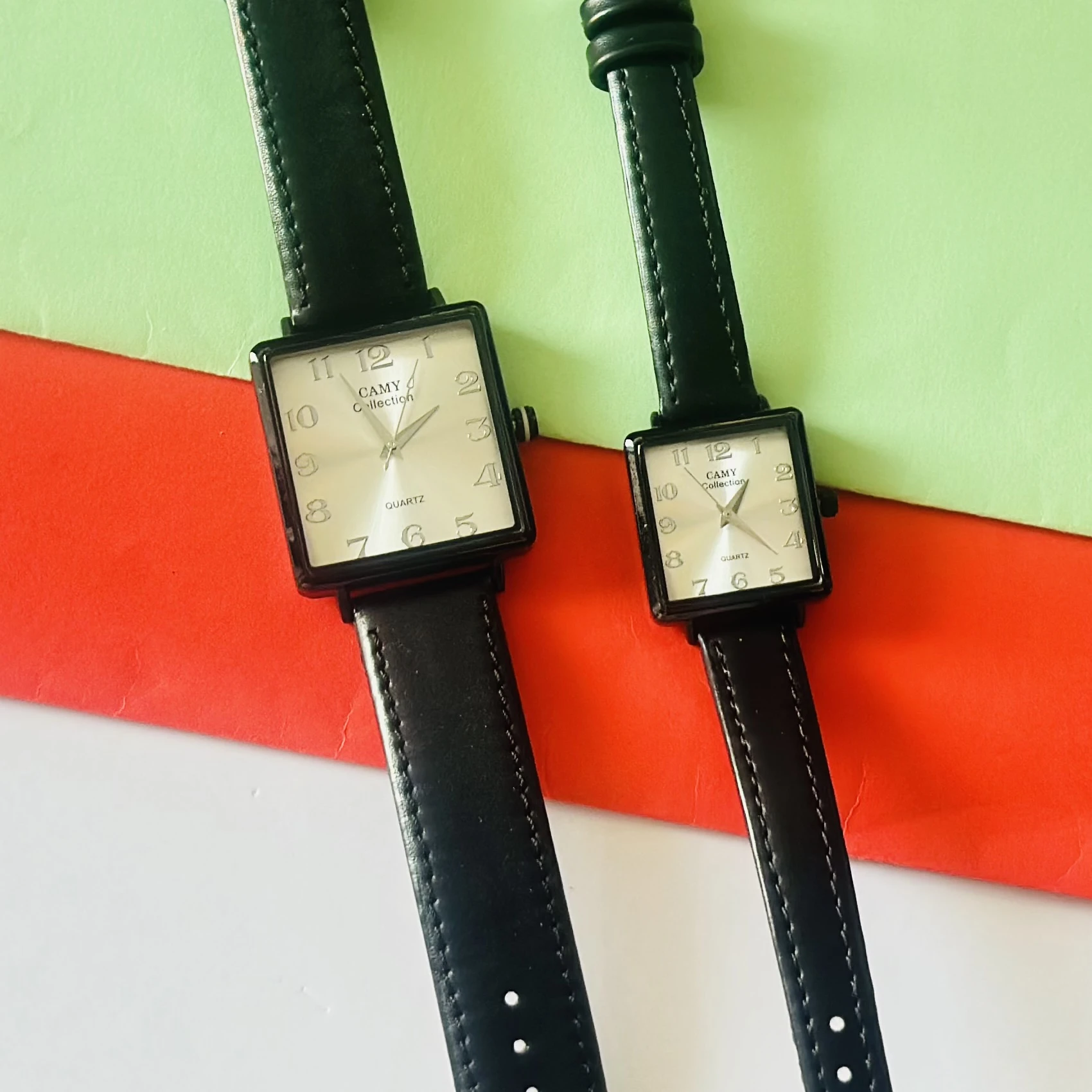 Camy Collection analog quartz watches with black leather straps and square dials.