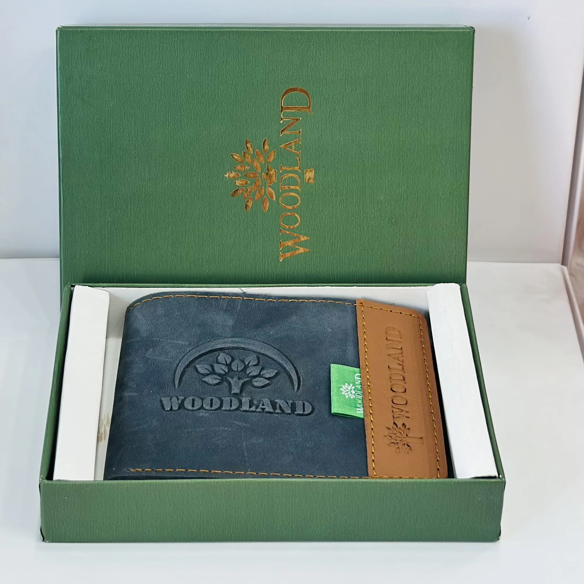 Woodland men's leather bi-fold wallet in a black and beige color block design.