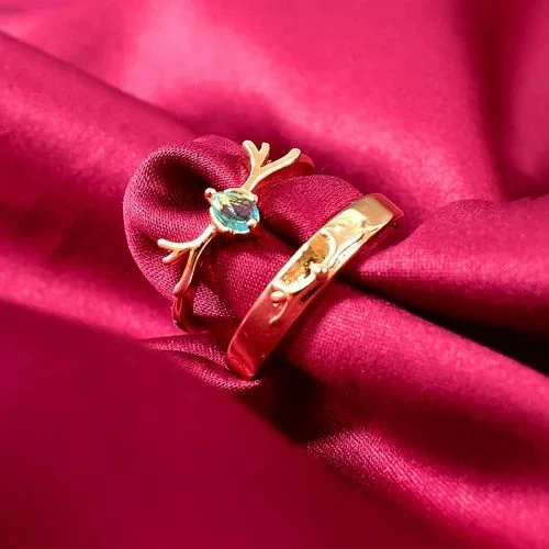 Rose gold nature-inspired wedding bands featuring a plain band and a twig branch ring