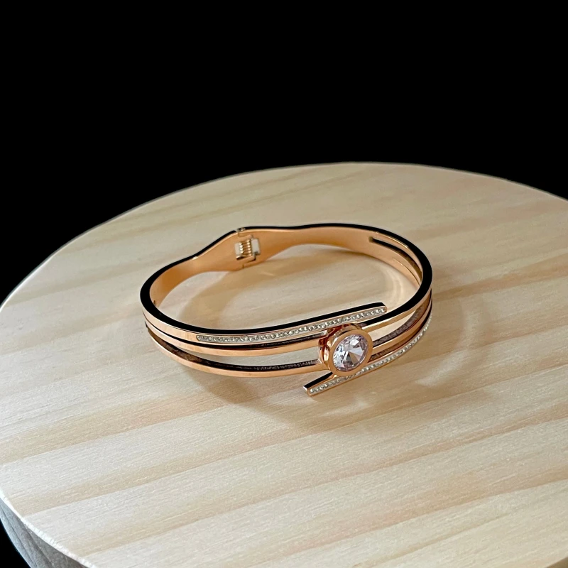 elegant gold-plated crystal-studded cuff bracelet