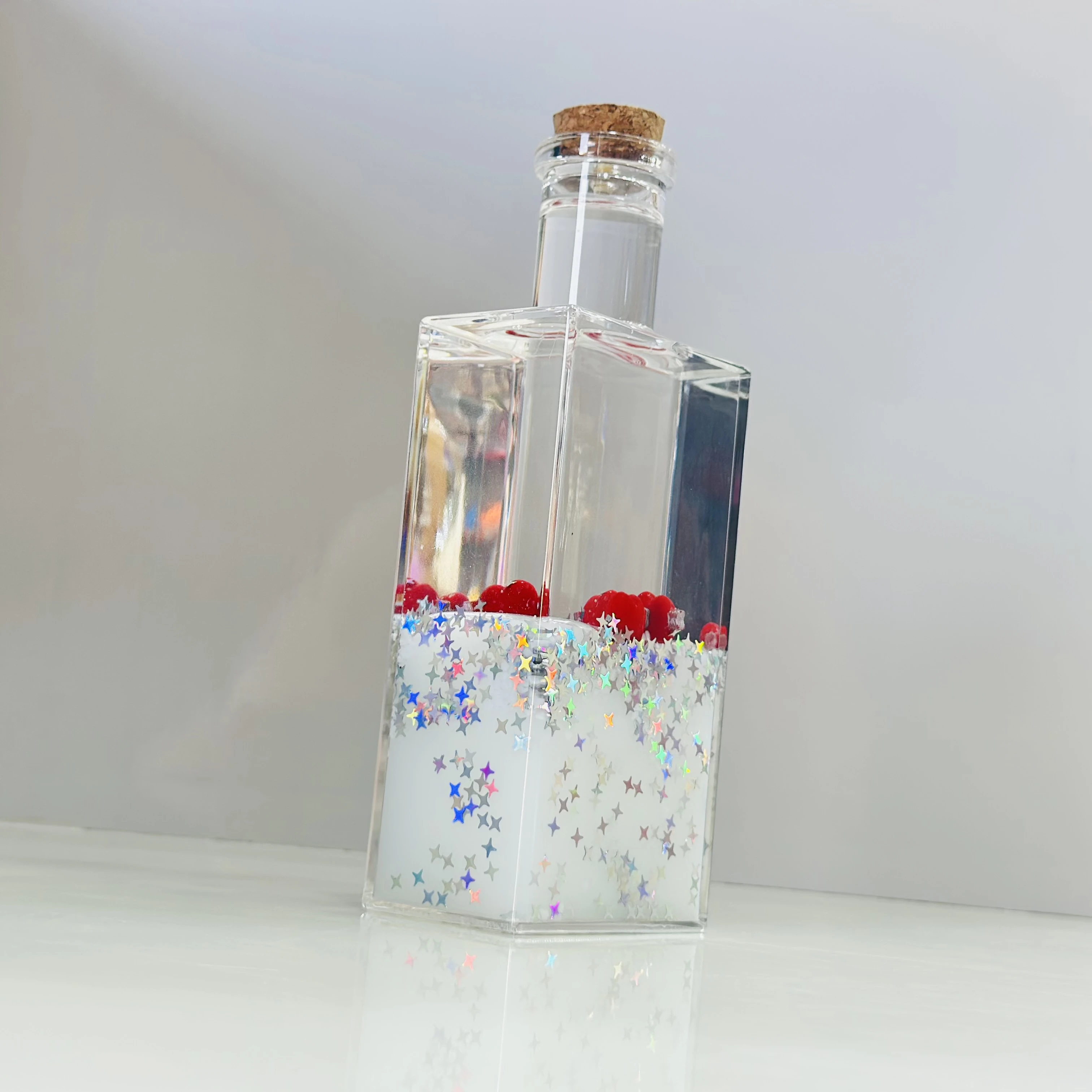 decorative fluid bottle with hearts and stars. (SKU-ATDL7R)