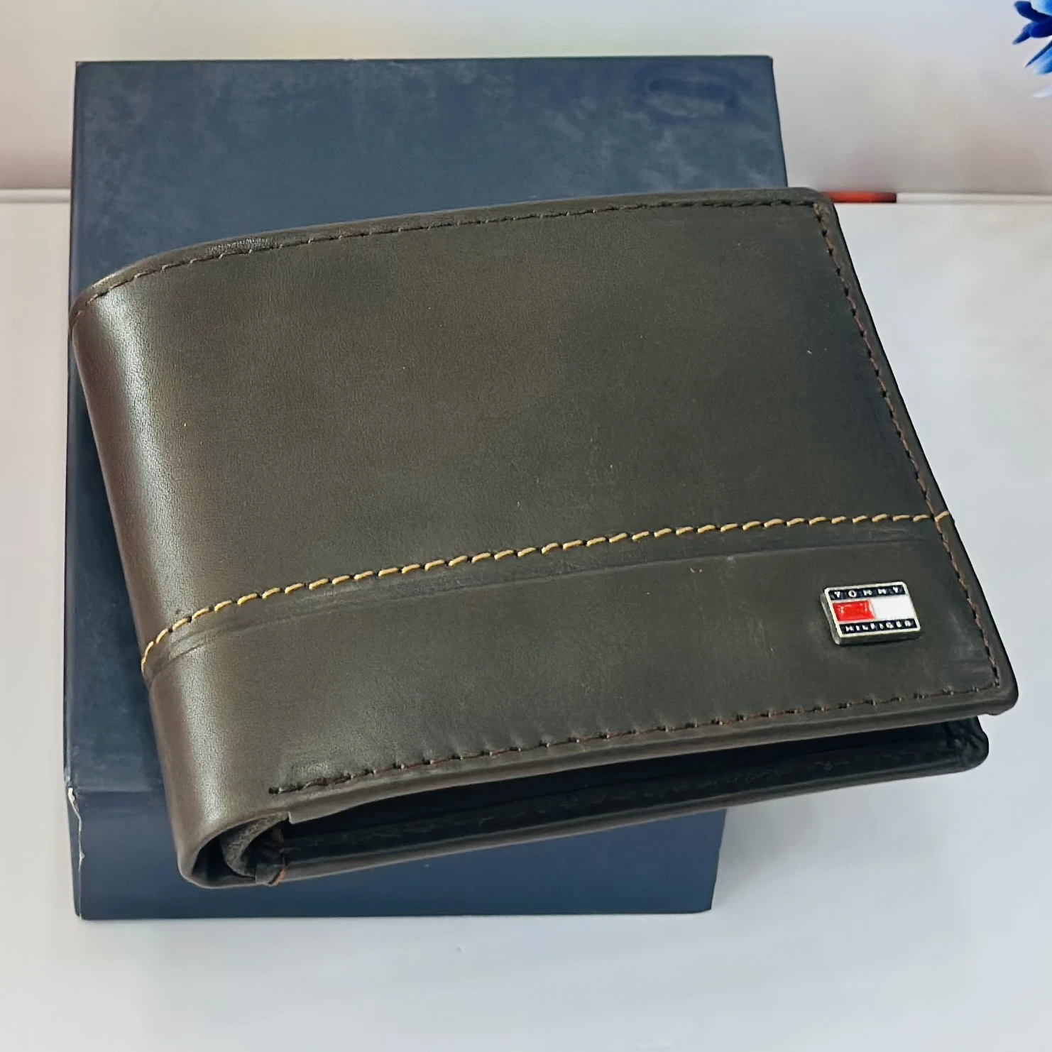 Tommy Hilfiger men's genuine leather bi-fold wallet.