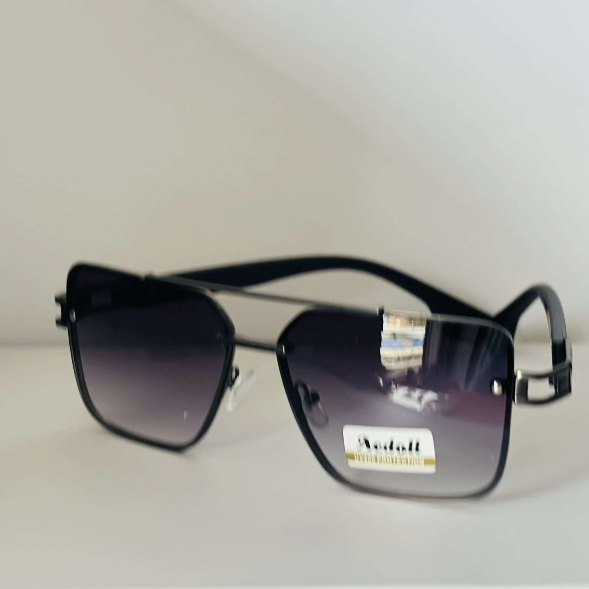 pair of Aedoll Goggle sunglasses with a gold metal frame and pink gradient lenses.