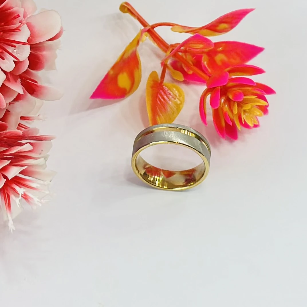 gold and silver-toned stainless steel dual-edge wedding band with a brushed finish