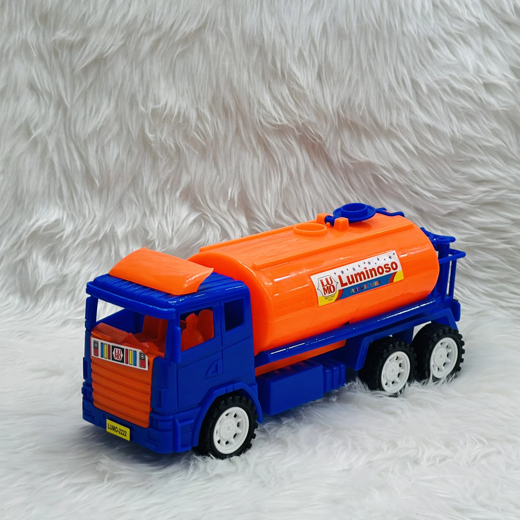 Luminoso brand friction-powered oil tanker truck toy.