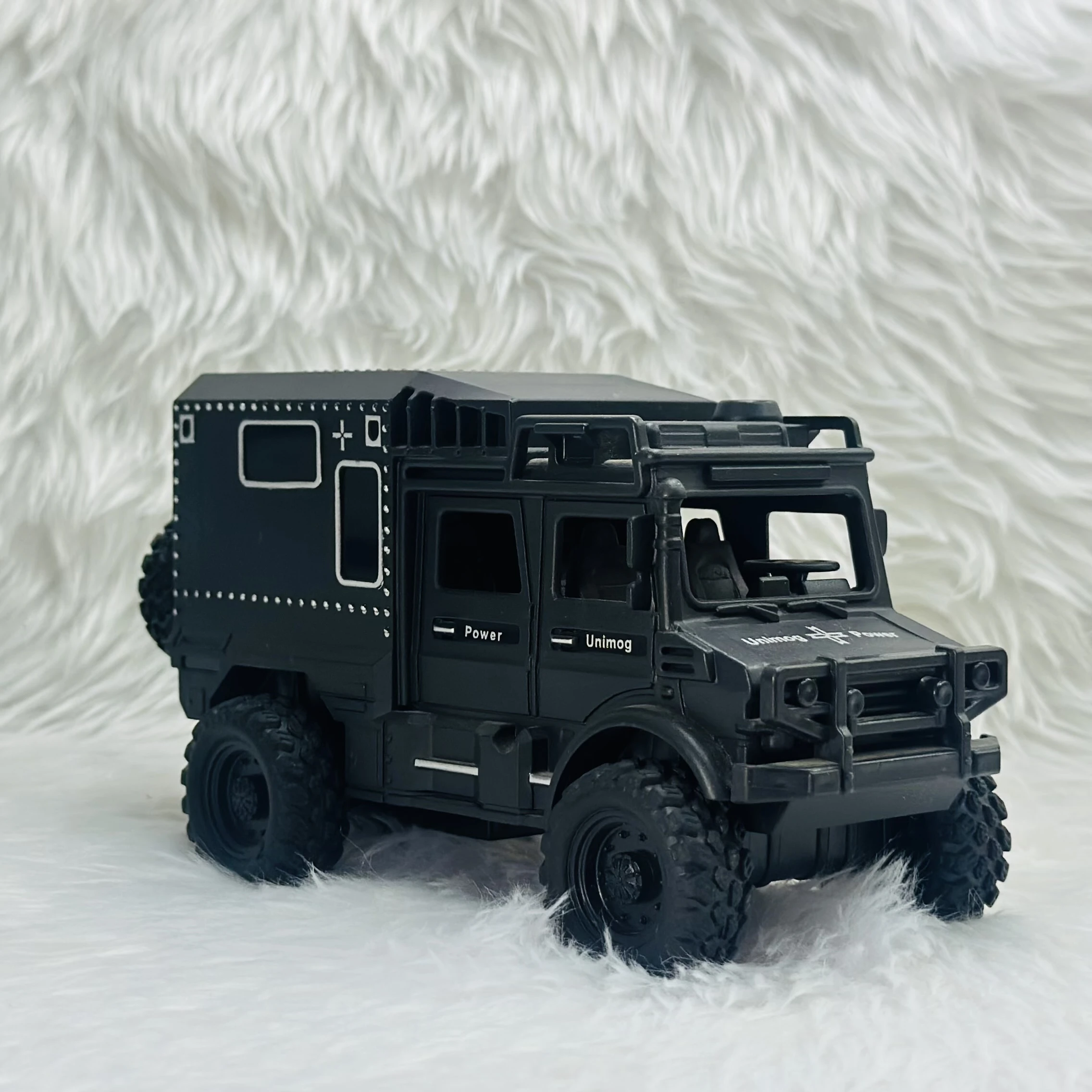 Toy Club Unimog army truck toy.