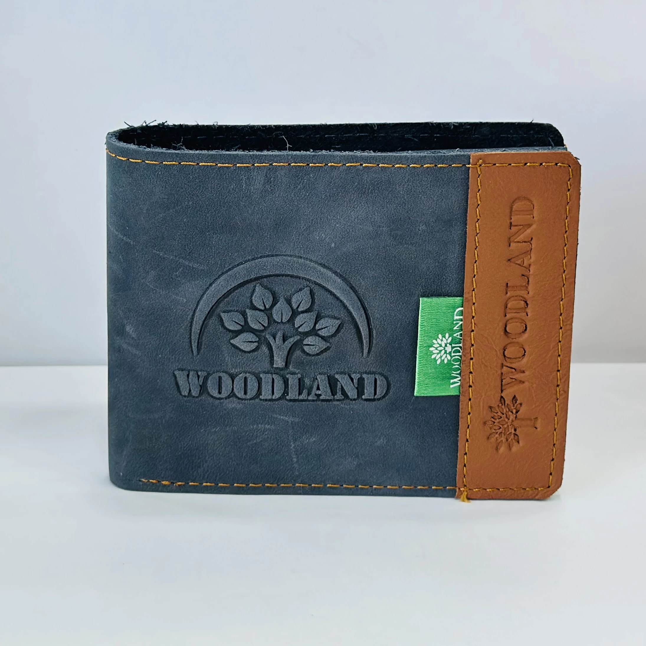 Woodland men's leather bi-fold wallet in a black and beige color block design.