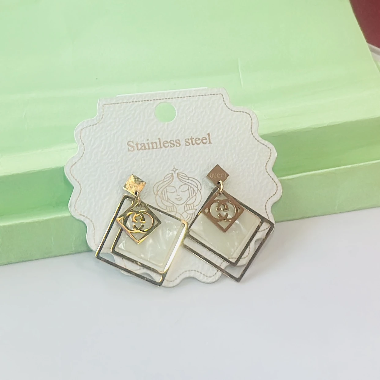 pair of anti-tarnish rose gold plated concentric chain drop earrings.