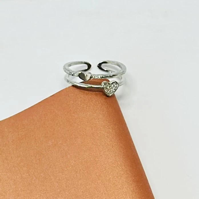An adjustable sterling silver double heart ring