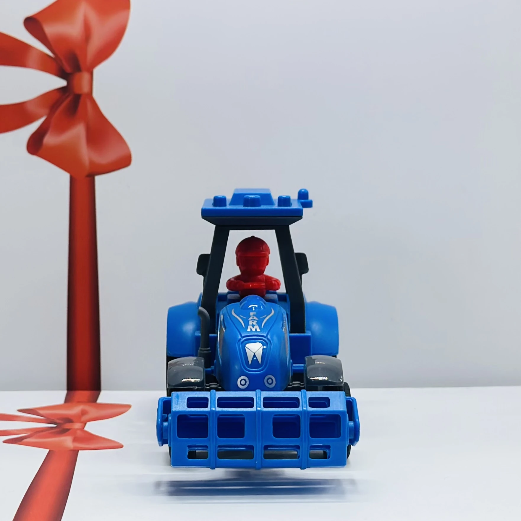 Blue plastic toy tractor