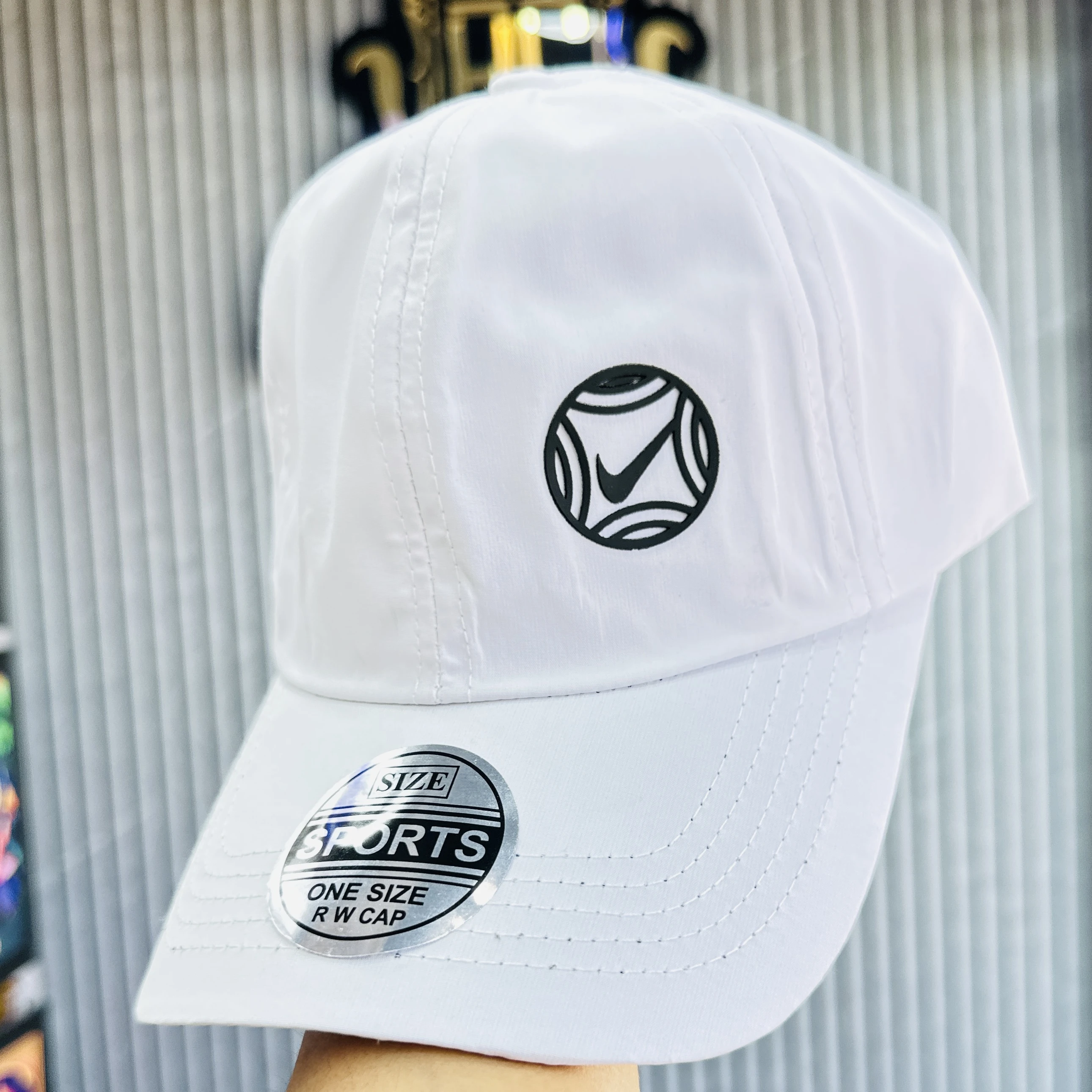 appears to be a white Nike branded baseball cap