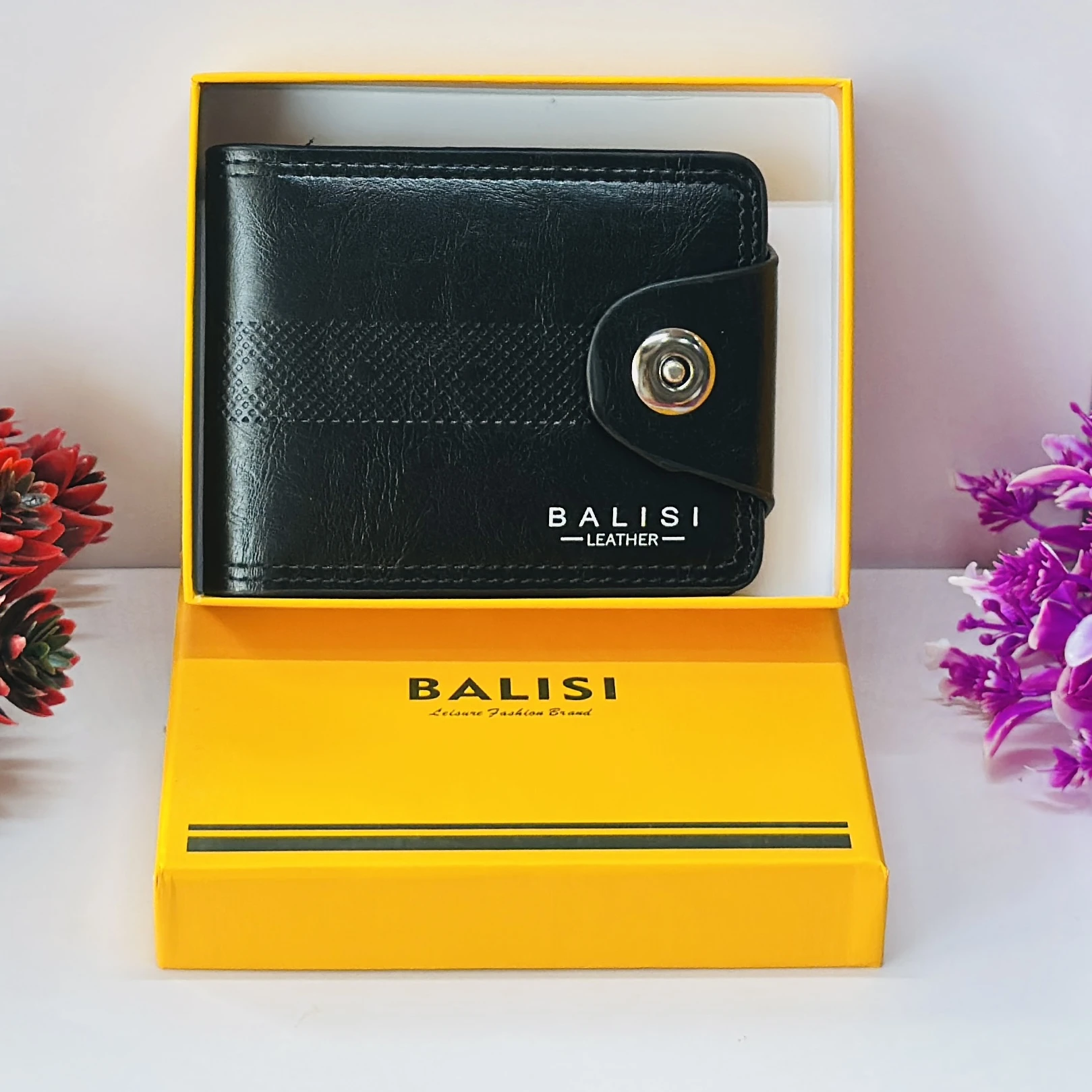 Black "Balisi" men's leather wallet with a button closure.
