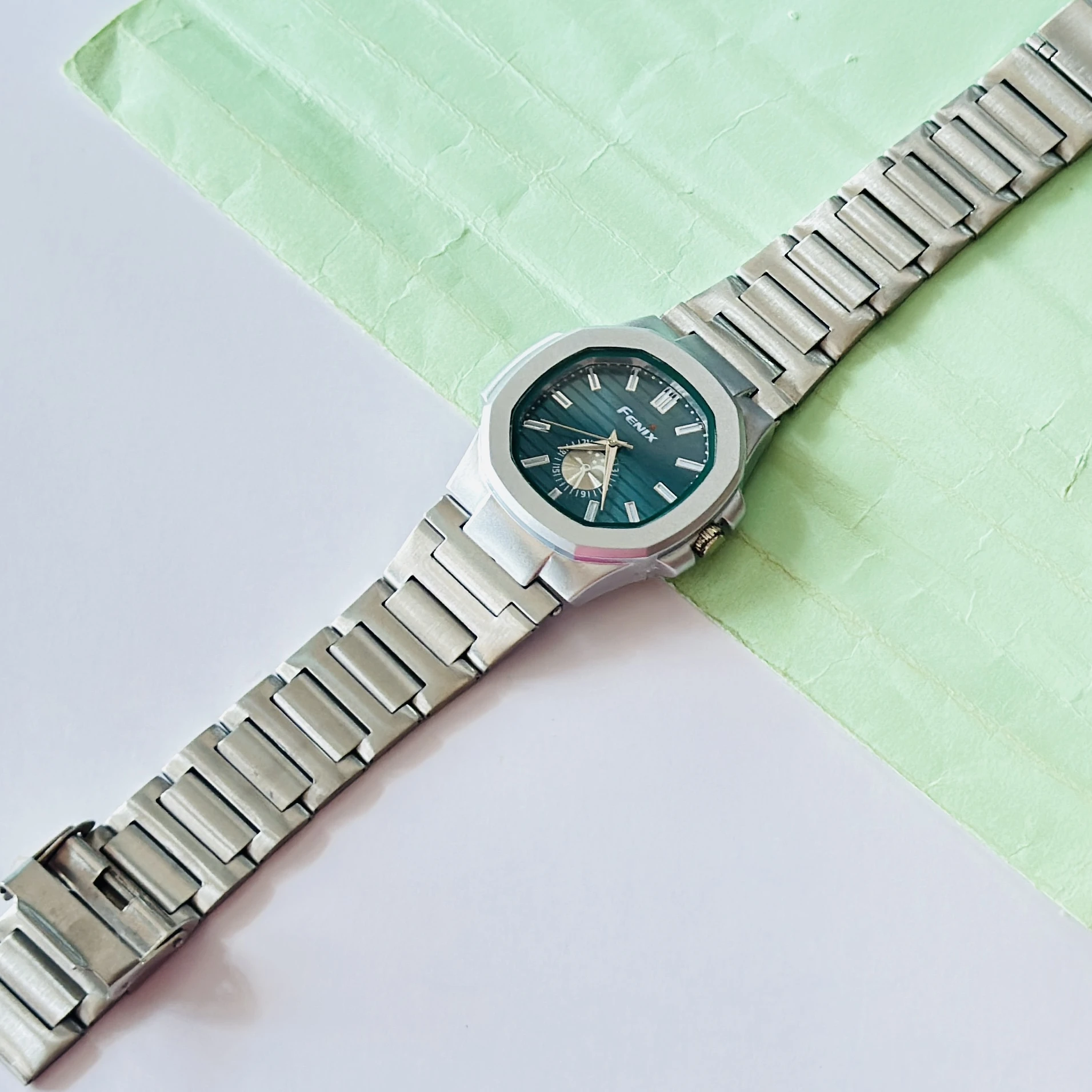 silver-toned stainless steel analogue watch
