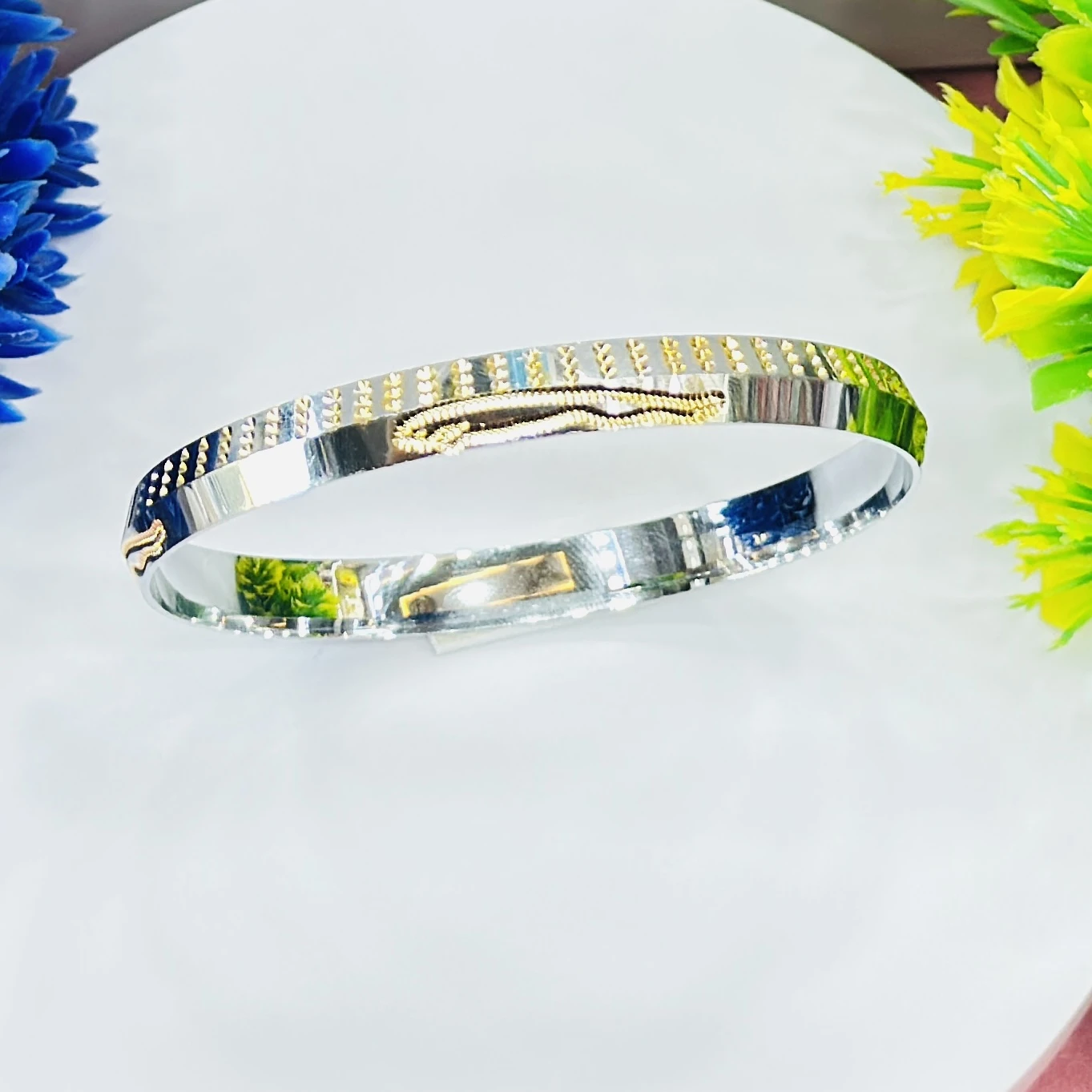 silver dual-tone men's kada with gold plating, featuring a polished finish.