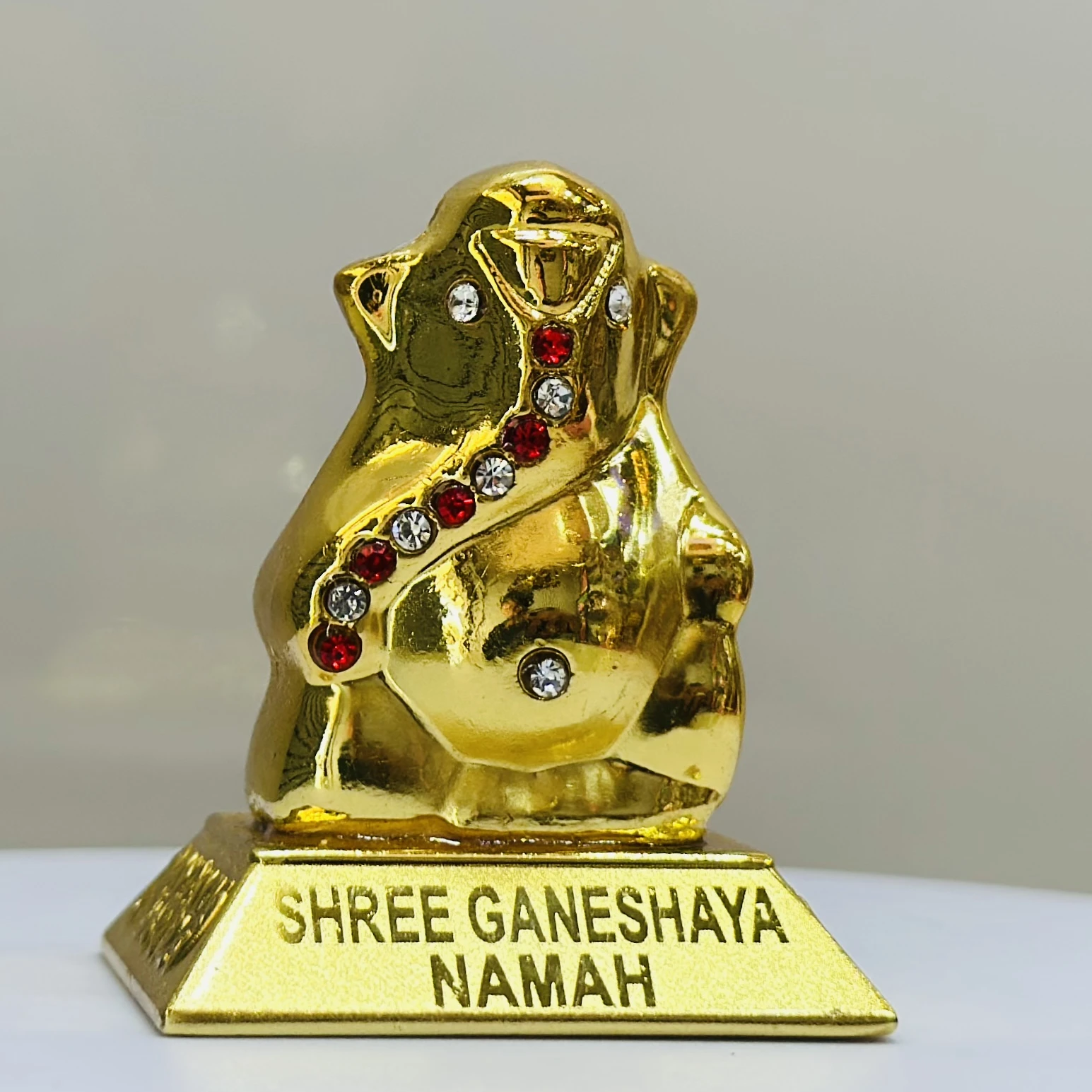 Gold colored idol of the Hindu deity Ganesha