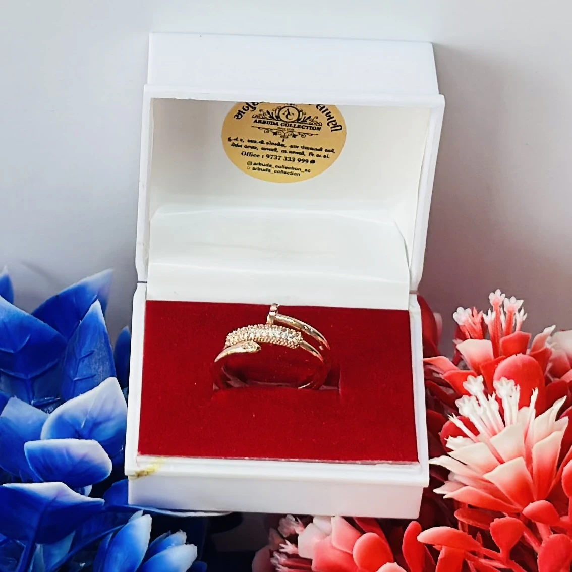 Gold and diamond snake-design ring