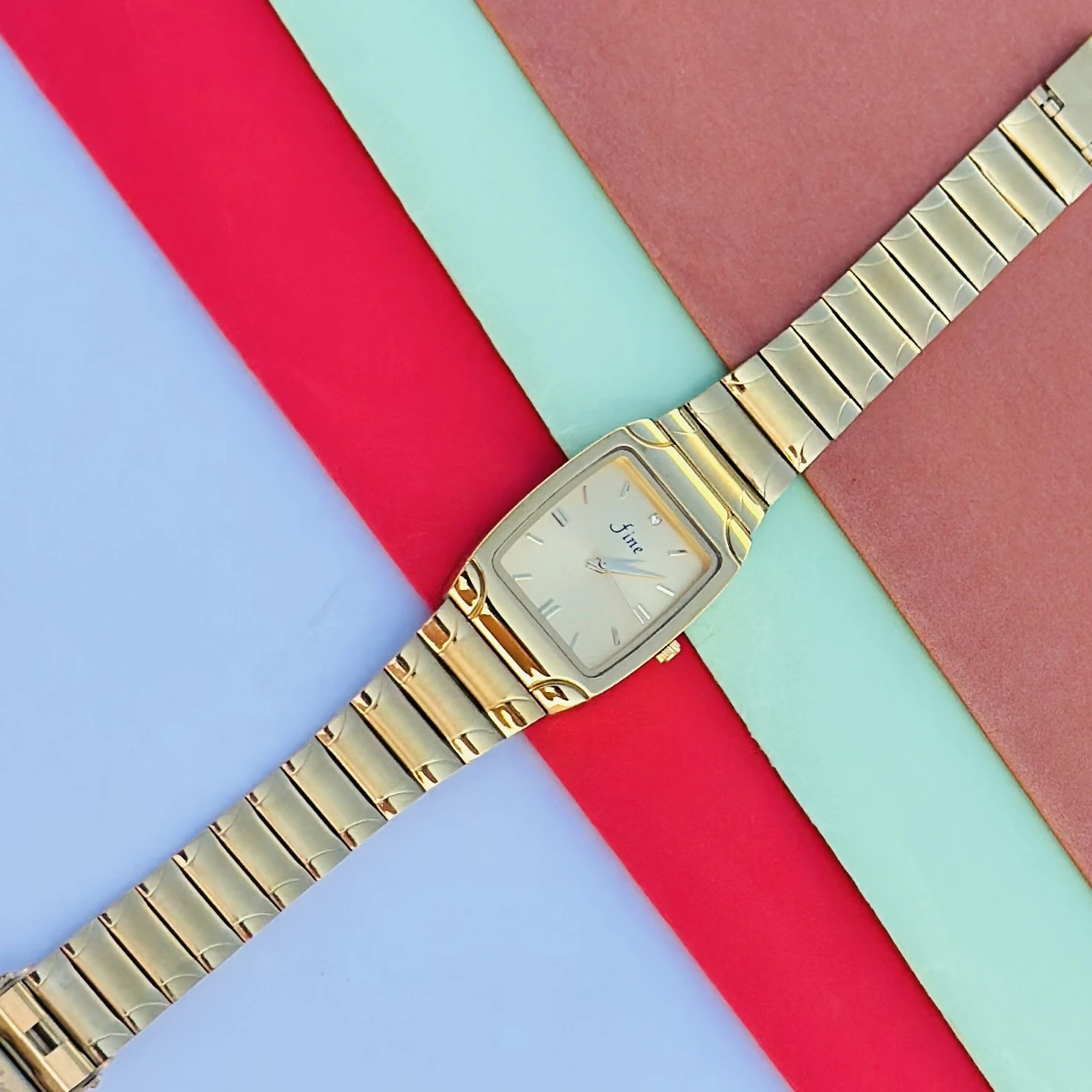 Gold tone analog wrist watch