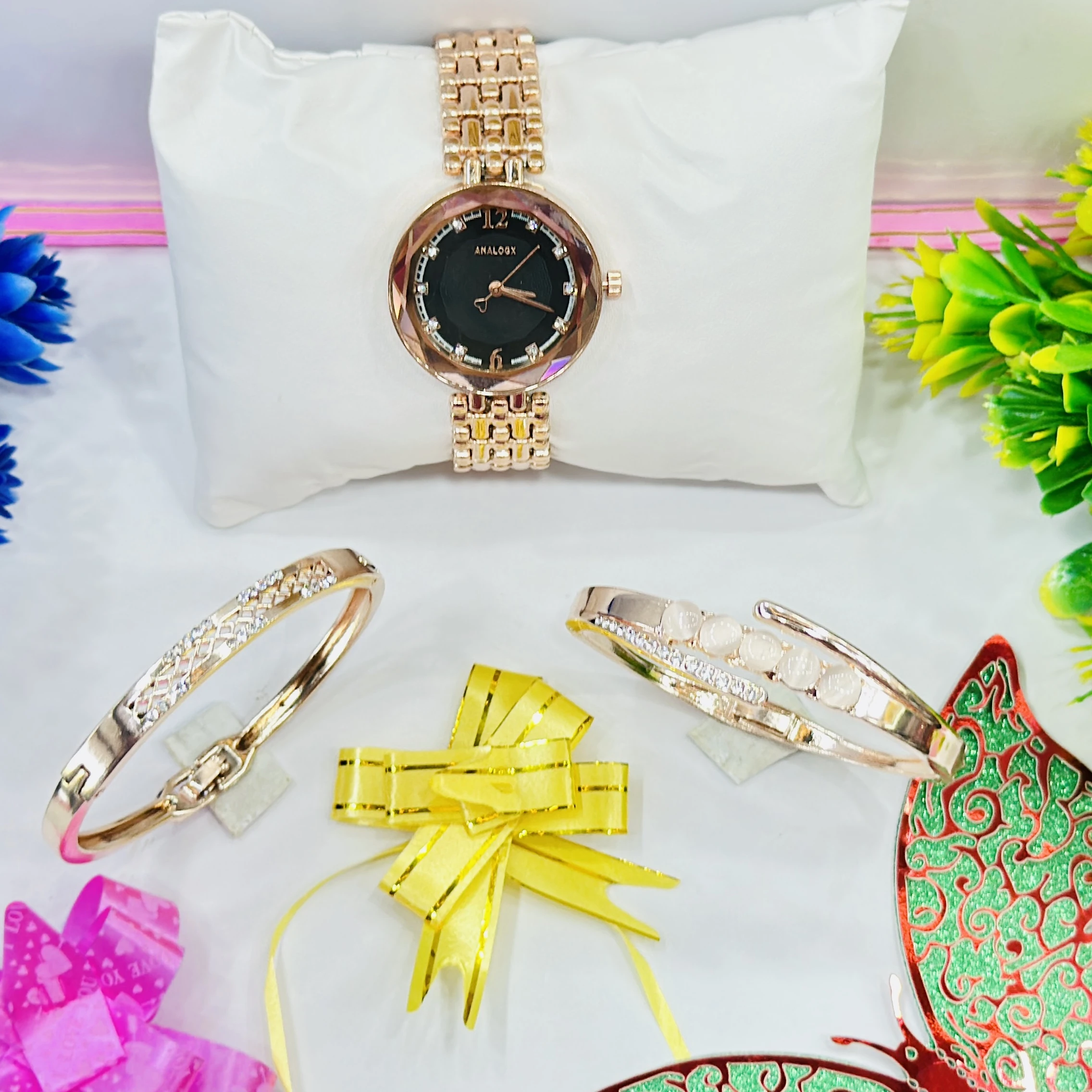 ladies' rose gold-tone Analogx brand watch set that includes matching bracelets.
