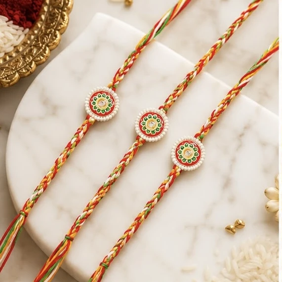 Meenakari Rakhis, featuring a set of three traditional multicolor threads.