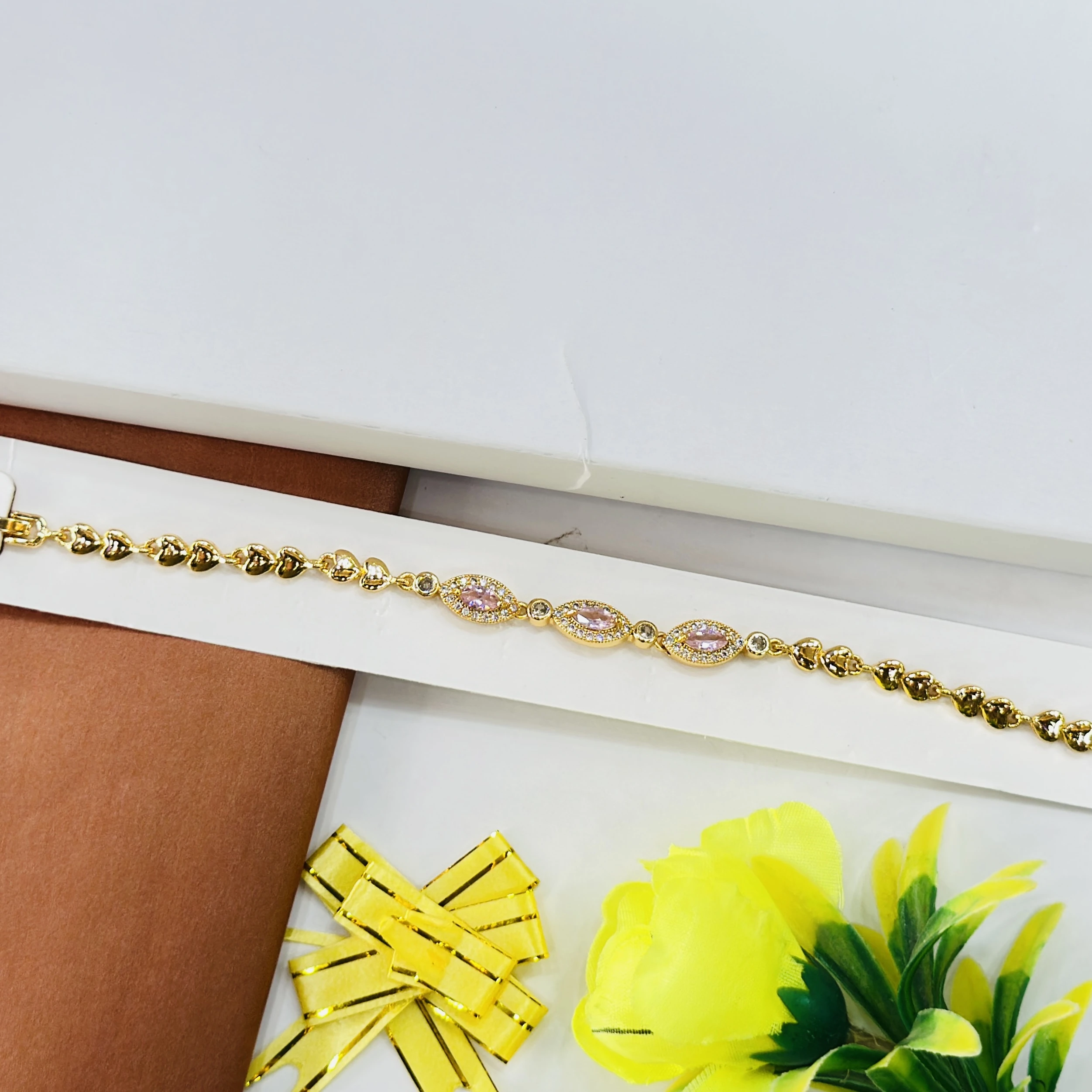 gold-plated bracelet featuring small heart-shaped links
