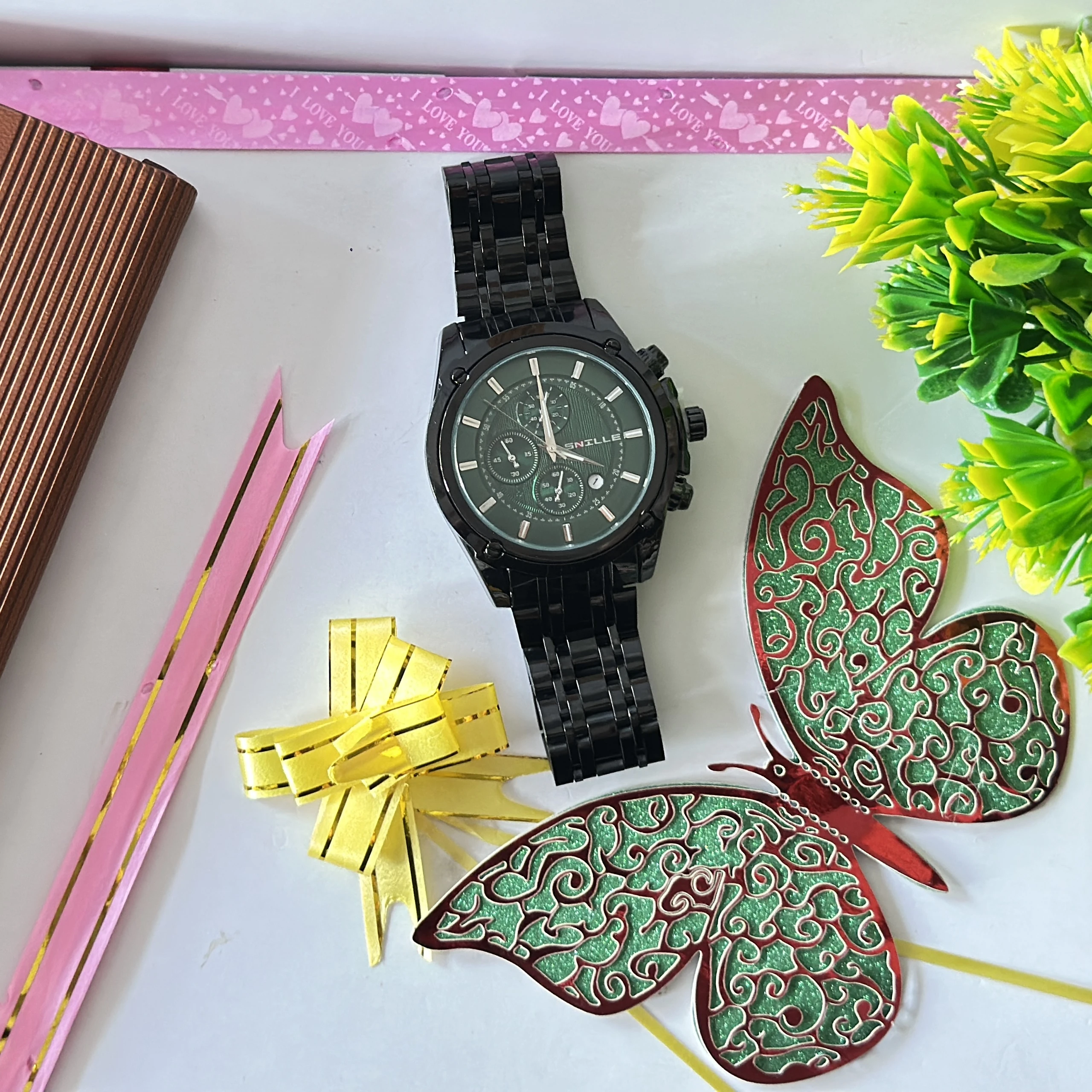 Black analog wristwatch with a metallic strap