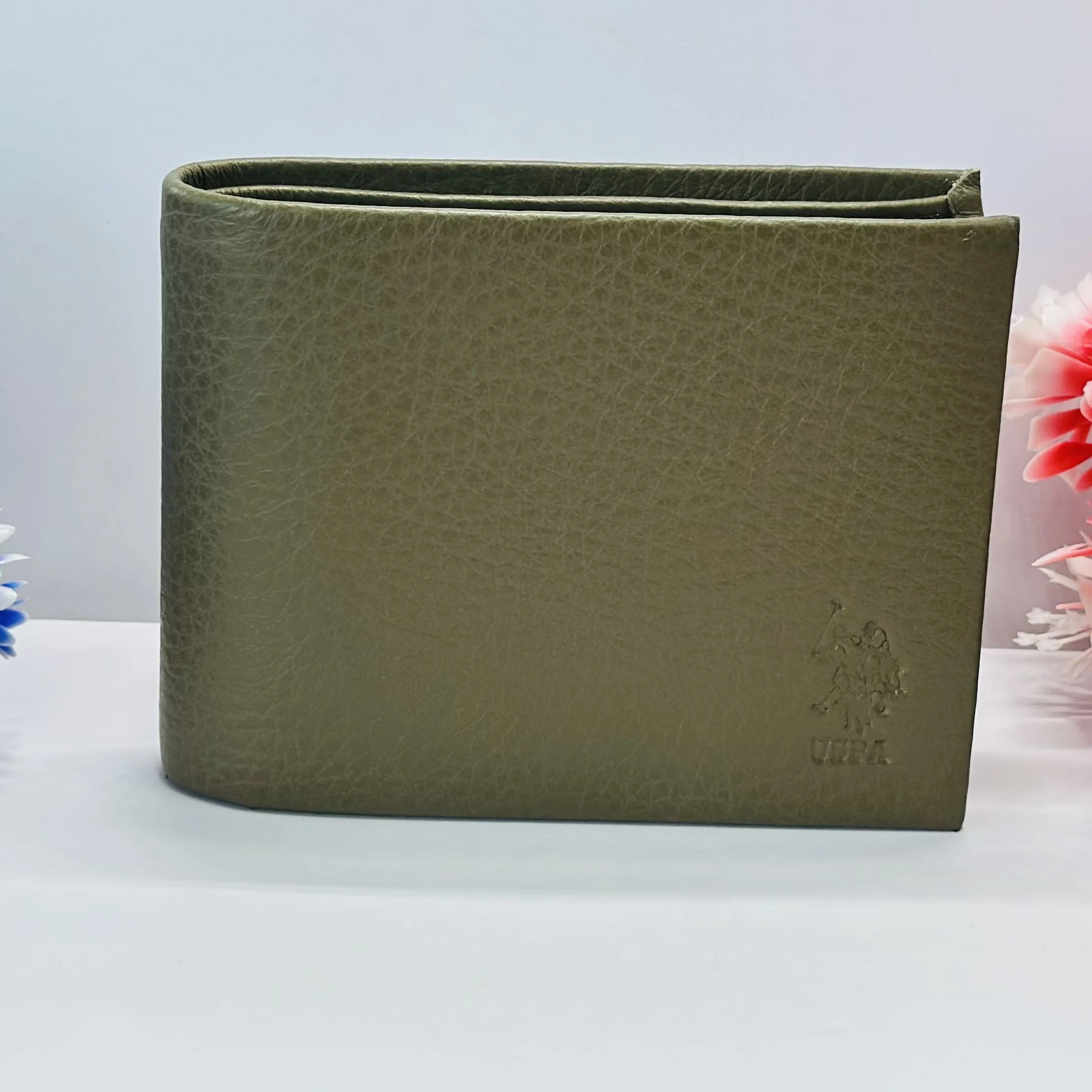 U.S. Polo Assn. bi-fold solid wallet in an olive color.