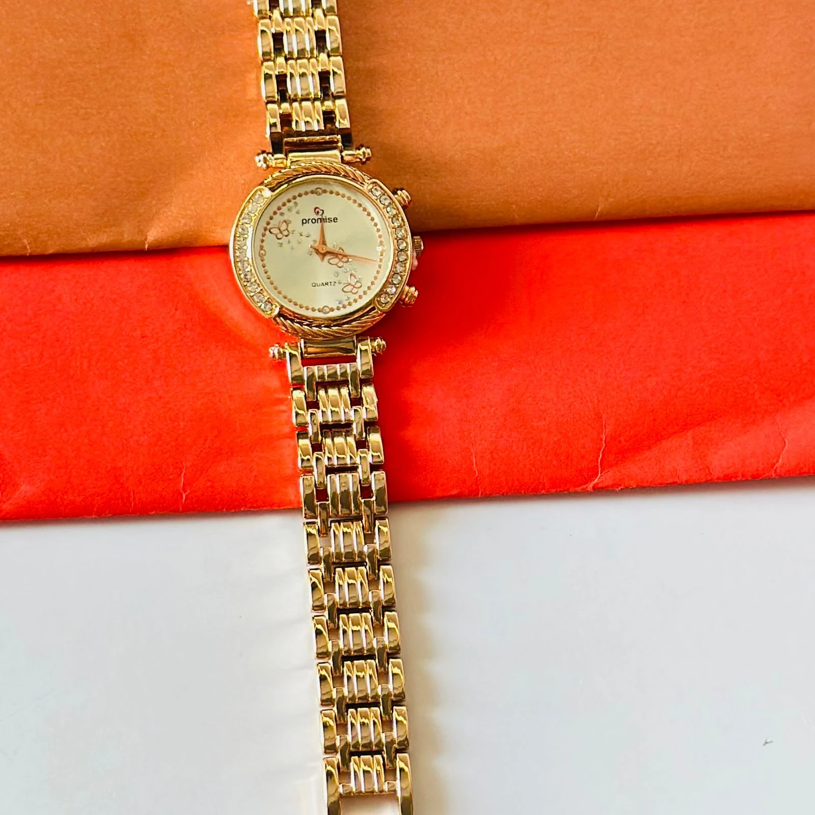 Felix women's analogue watch with a rose gold-toned metal strap