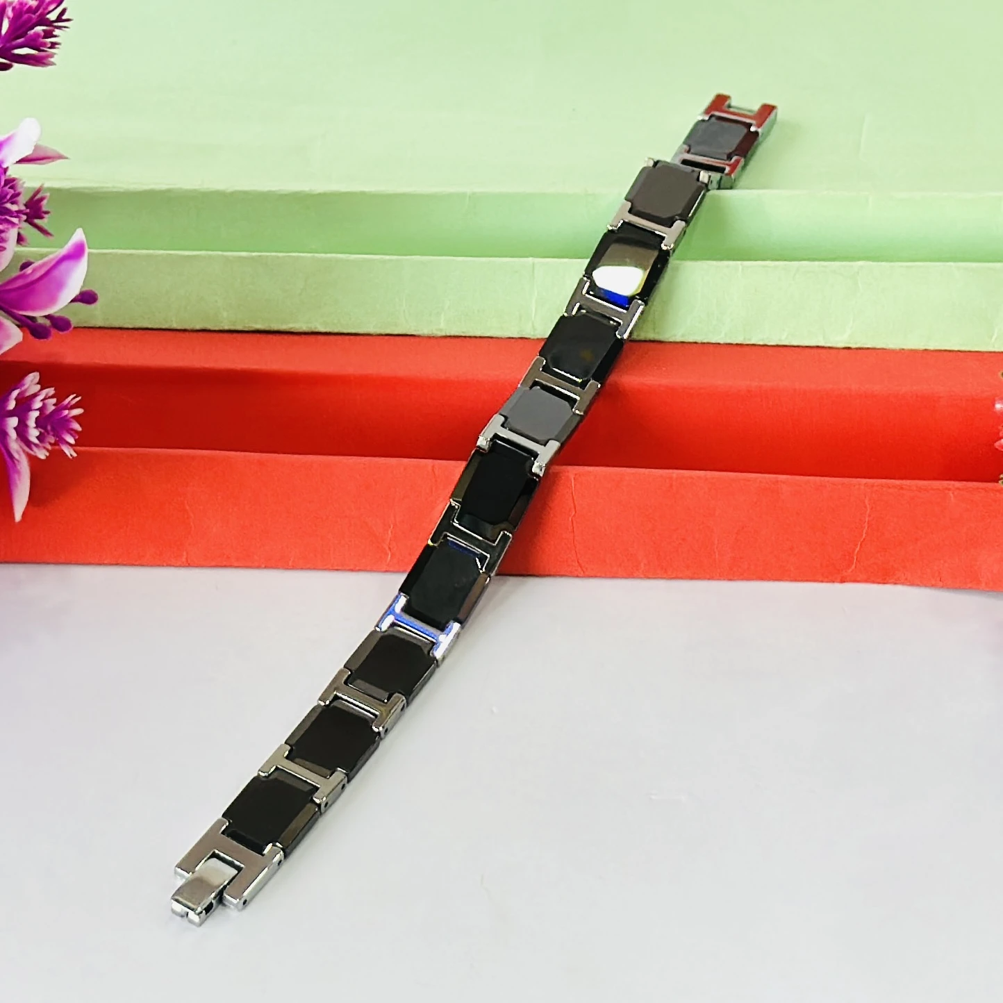 men's stainless steel and black ceramic (or rubber) link bracelet.