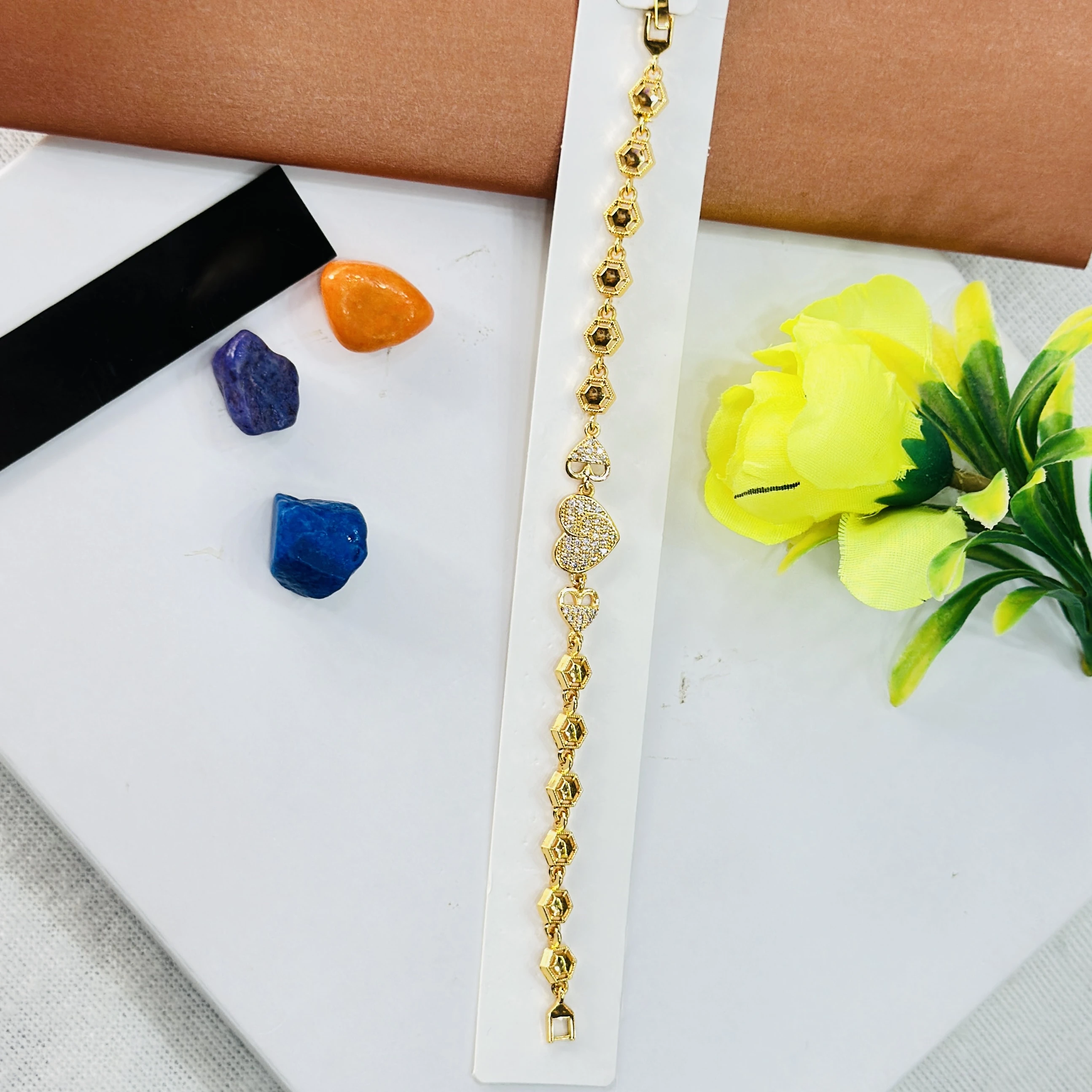 Gold plated bracelet with a central clover design