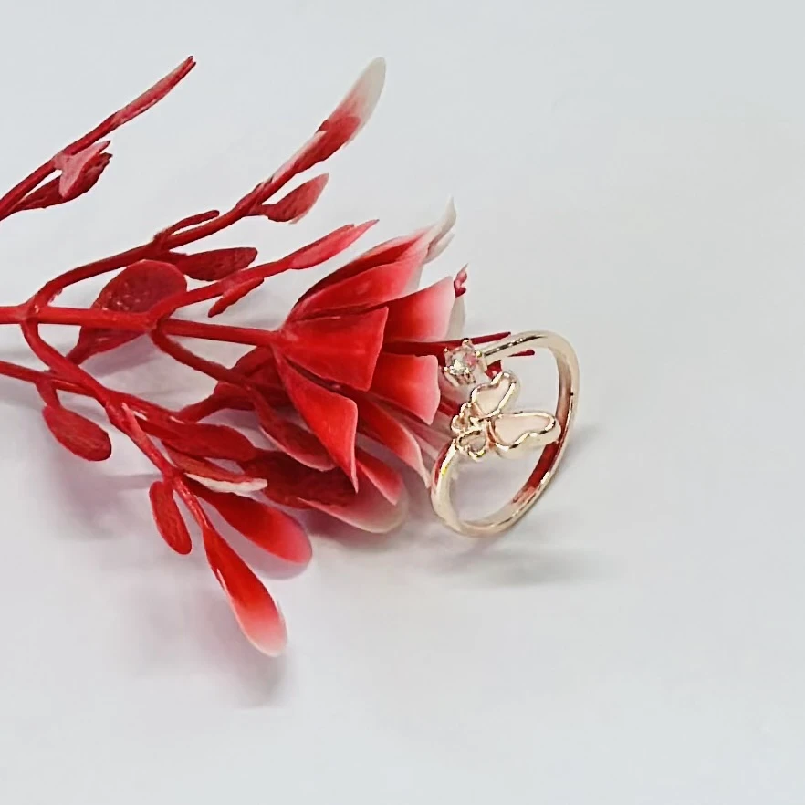 Rose gold-plated 925 sterling silver butterfly ring with a studded crystal.