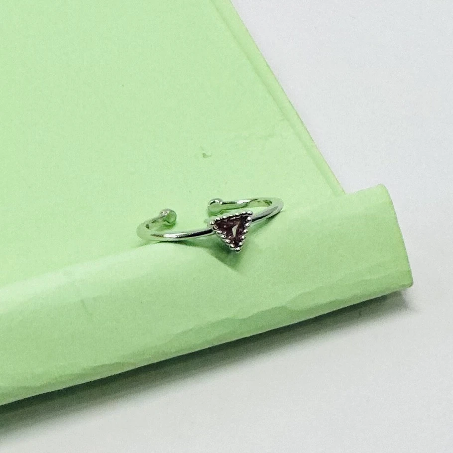 an emerald-cut imperial topaz or citrine solitaire ring in 14k gold.