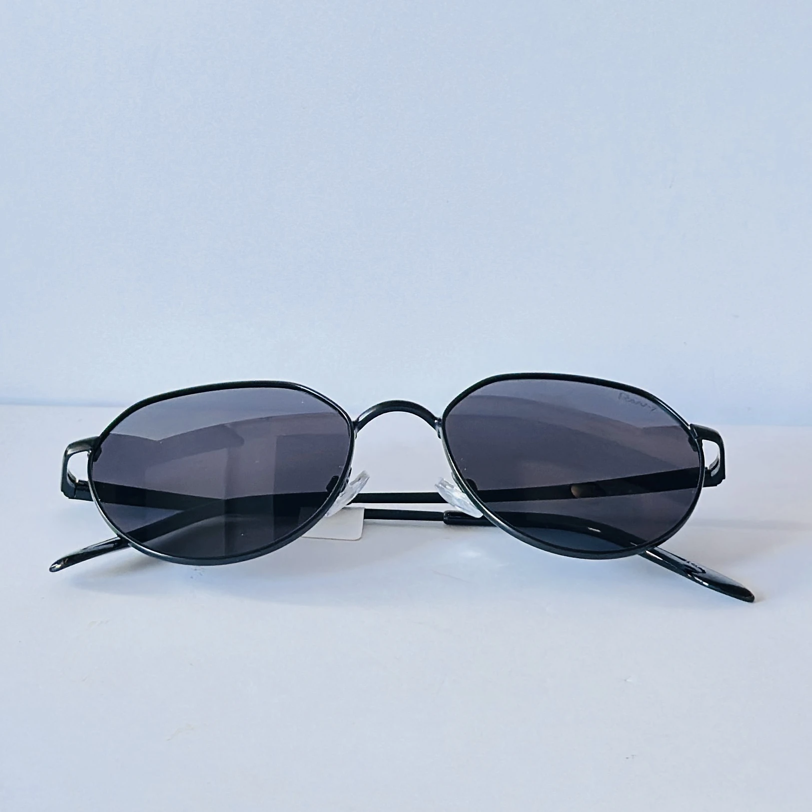 Ray-Ban style hexagonal sunglasses with a black metal frame.