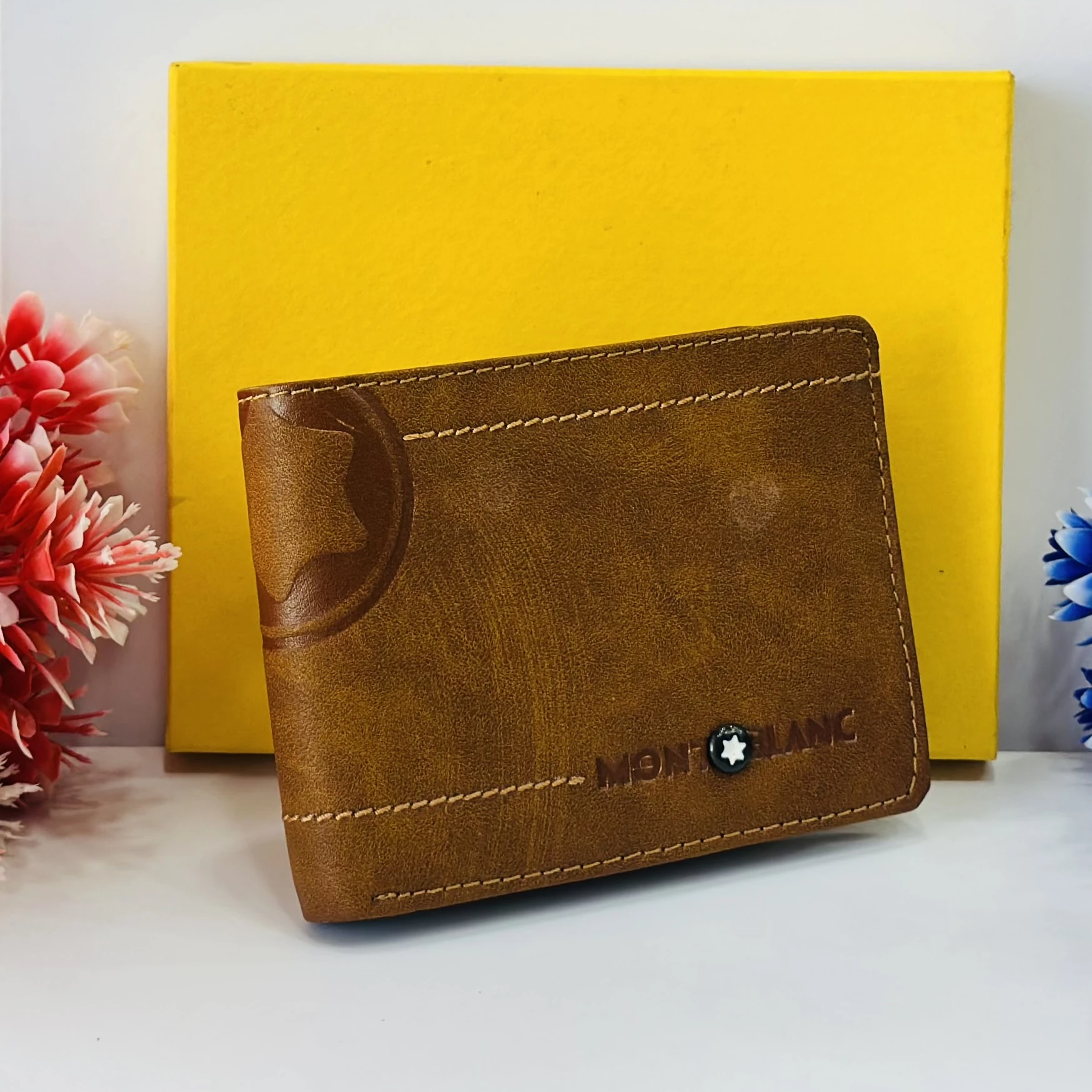 Brown bifold leather wallet in a Montblanc gift box.