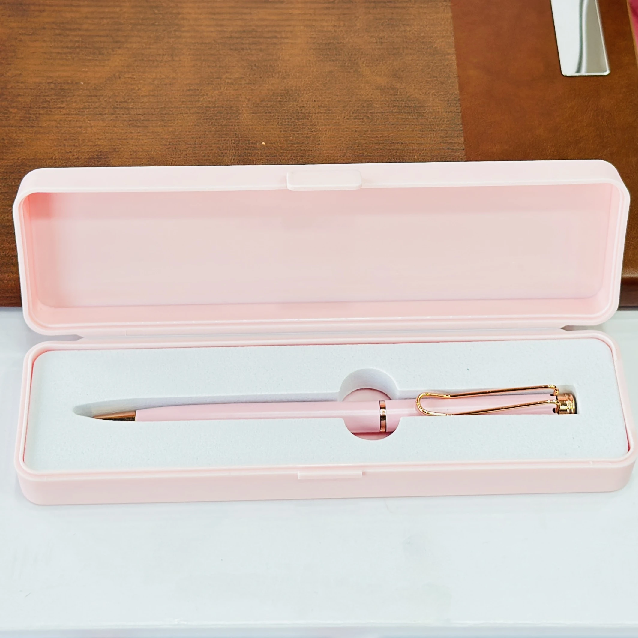 pink and rose gold ballpoint pen