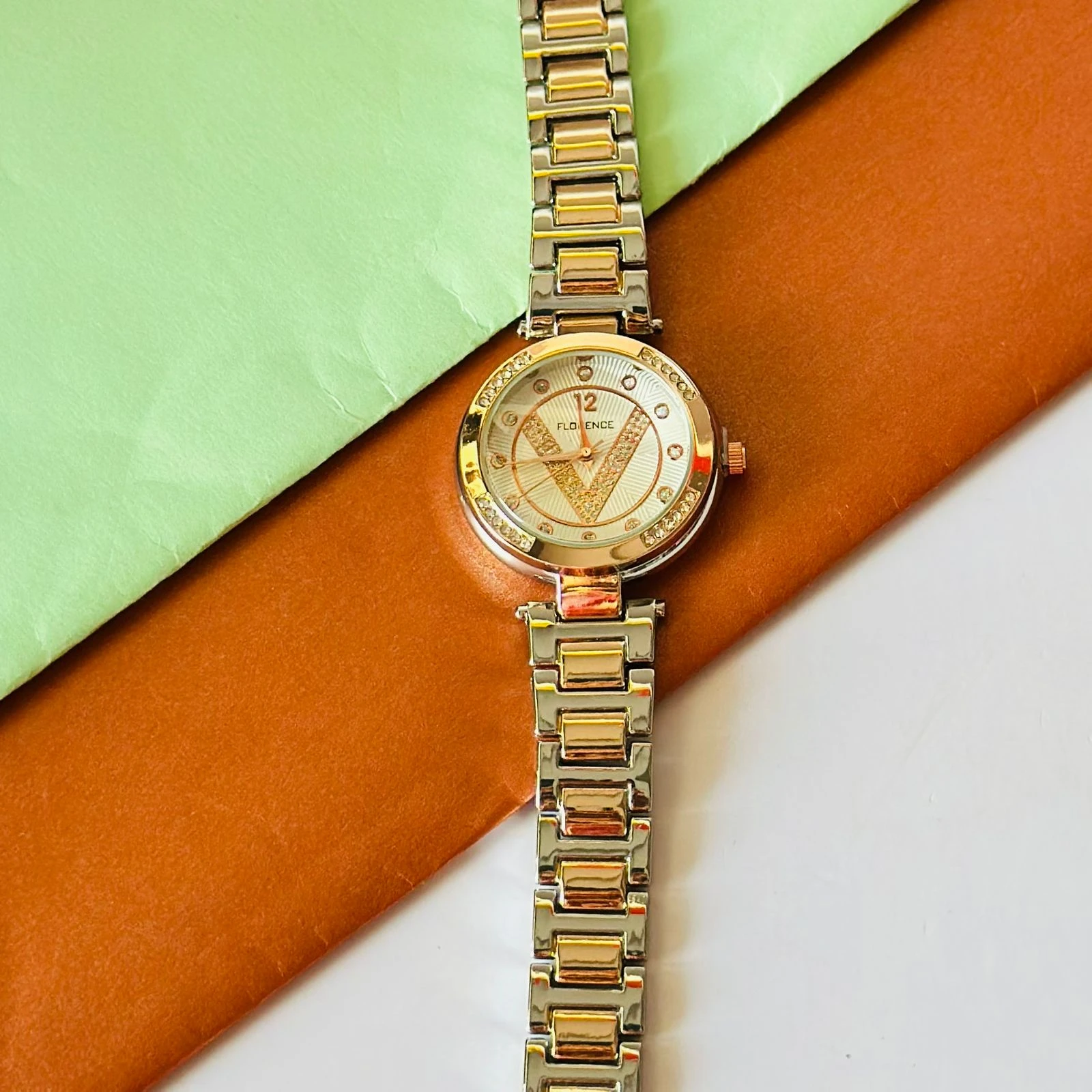 Florence brand two-tone metal analog watch for women.