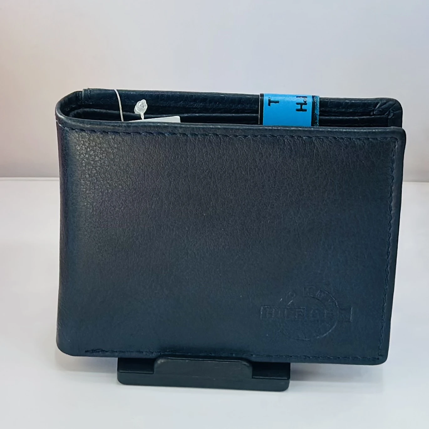 Blue Tommy Hilfiger men's genuine leather bi-fold wallet.