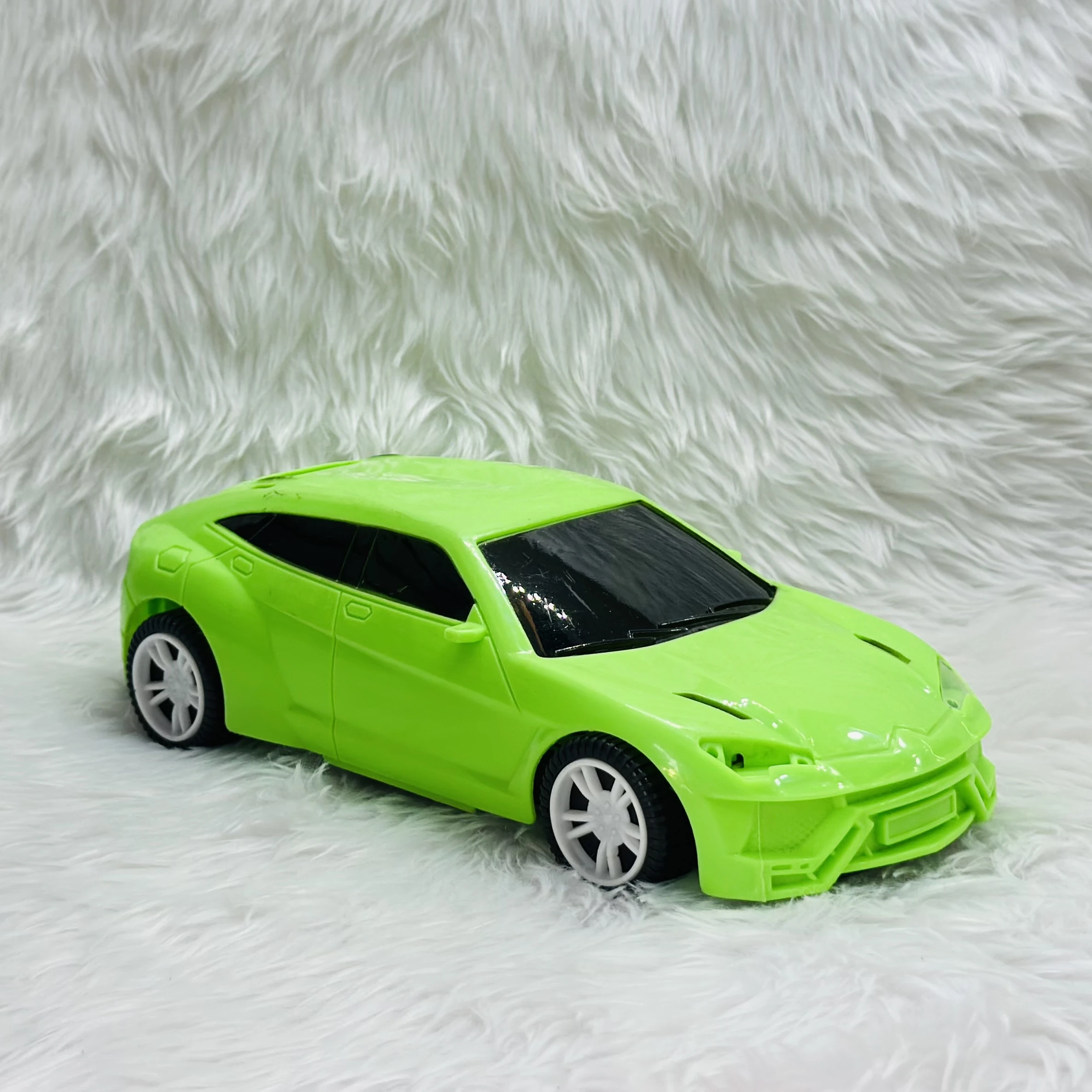 Green toy car, which is a model of a Lamborghini Urus SUV.